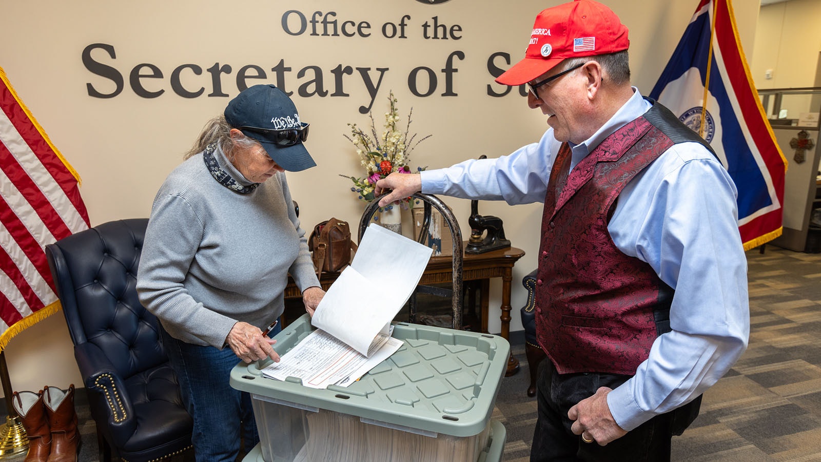 Thermopolis resident Cheryl Aguiar inspects some of the 44,650 signatures her group collected.