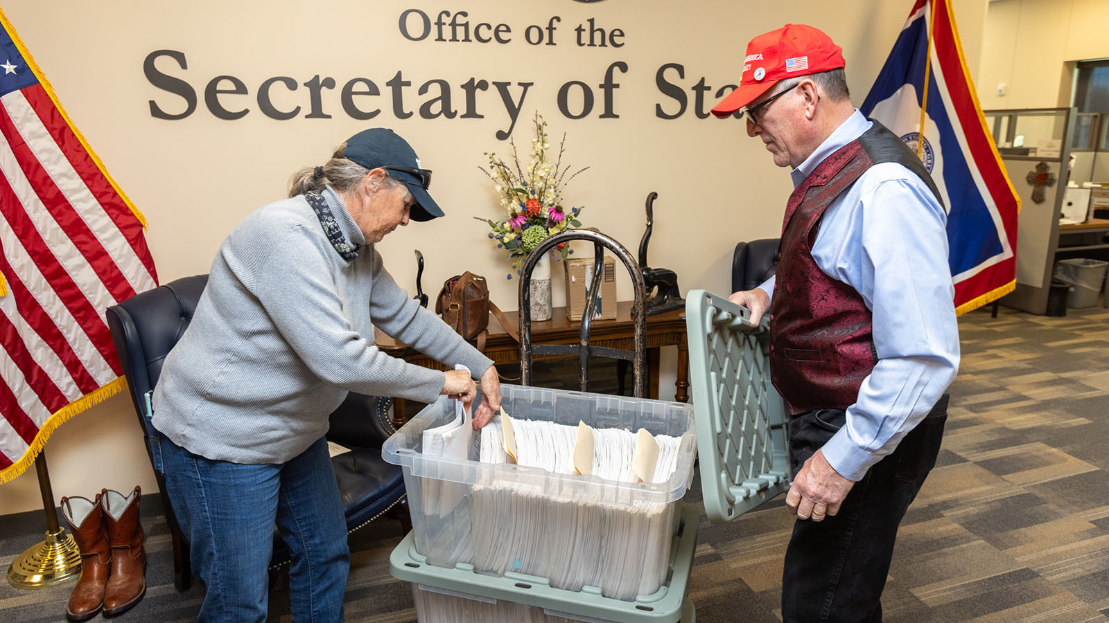 Thermopolis resident Cheryl Aguiar inspects some of the 44,650 signatures her group collected and turned in to the Secretary of State's Office in May.