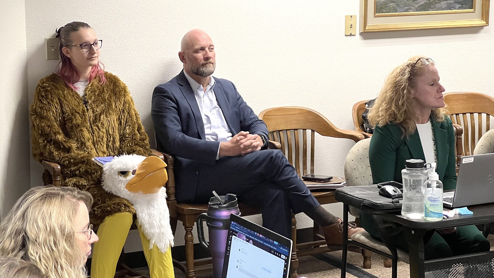 Maggie Imman, a University of Wyoming student, attended Thursday's Wyoming Public Service Commission meeting in Cheyenne dressed as a bald eagle to comment on the costs of electricity in the state and the toll wind turbines take on eagles.
