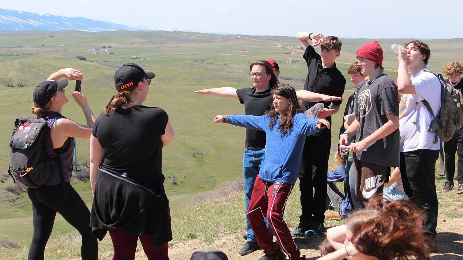 Students enjoy a candid moment during an afternoon spent on Soldier Ridge Trail after spending the morning volunteering for the Sheridan Communty Land Trust.