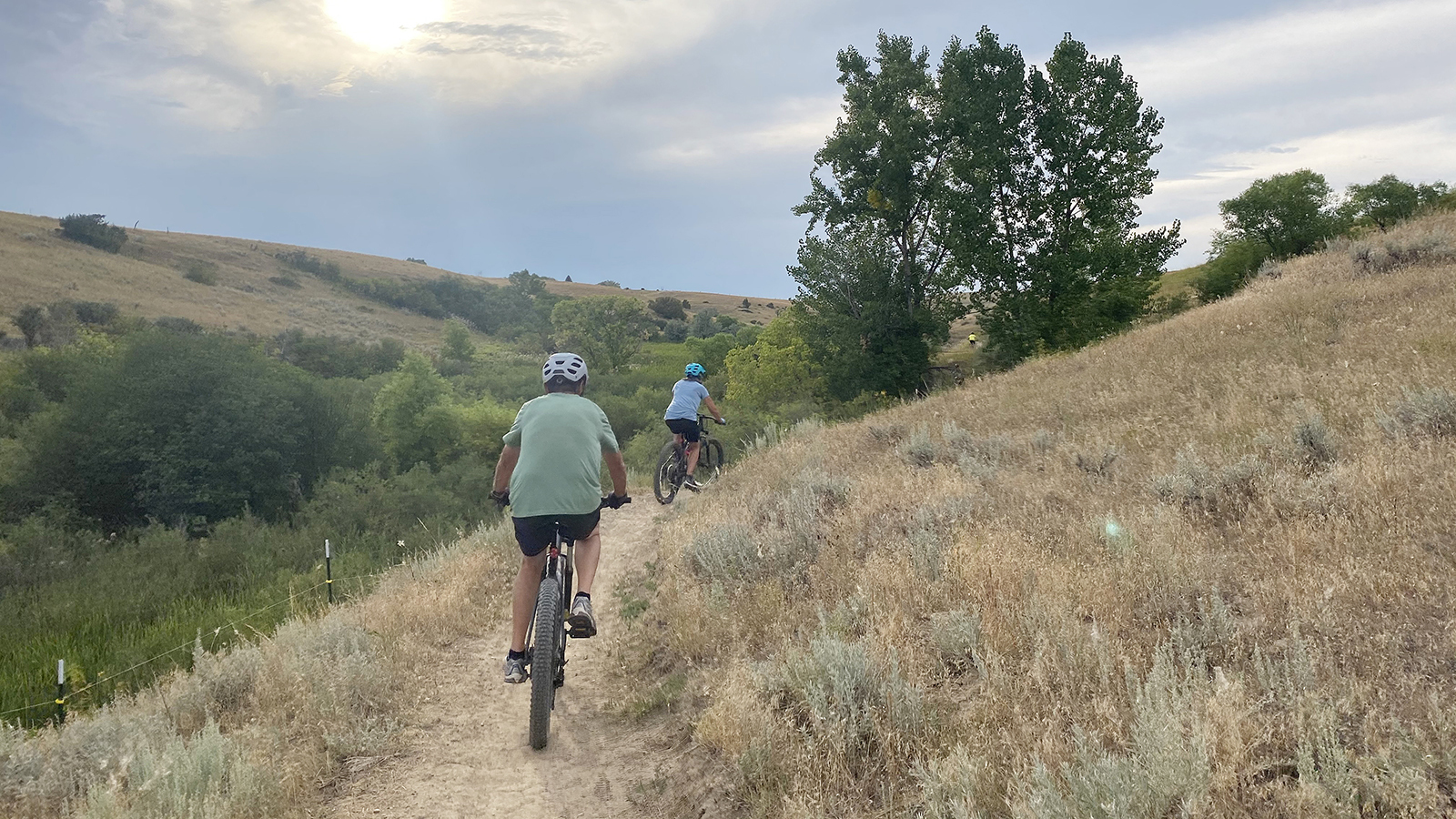 Two mountain bikers ride Hidden Hoot Trail, one of the segments of trail added to Soldier Ridge Trail.