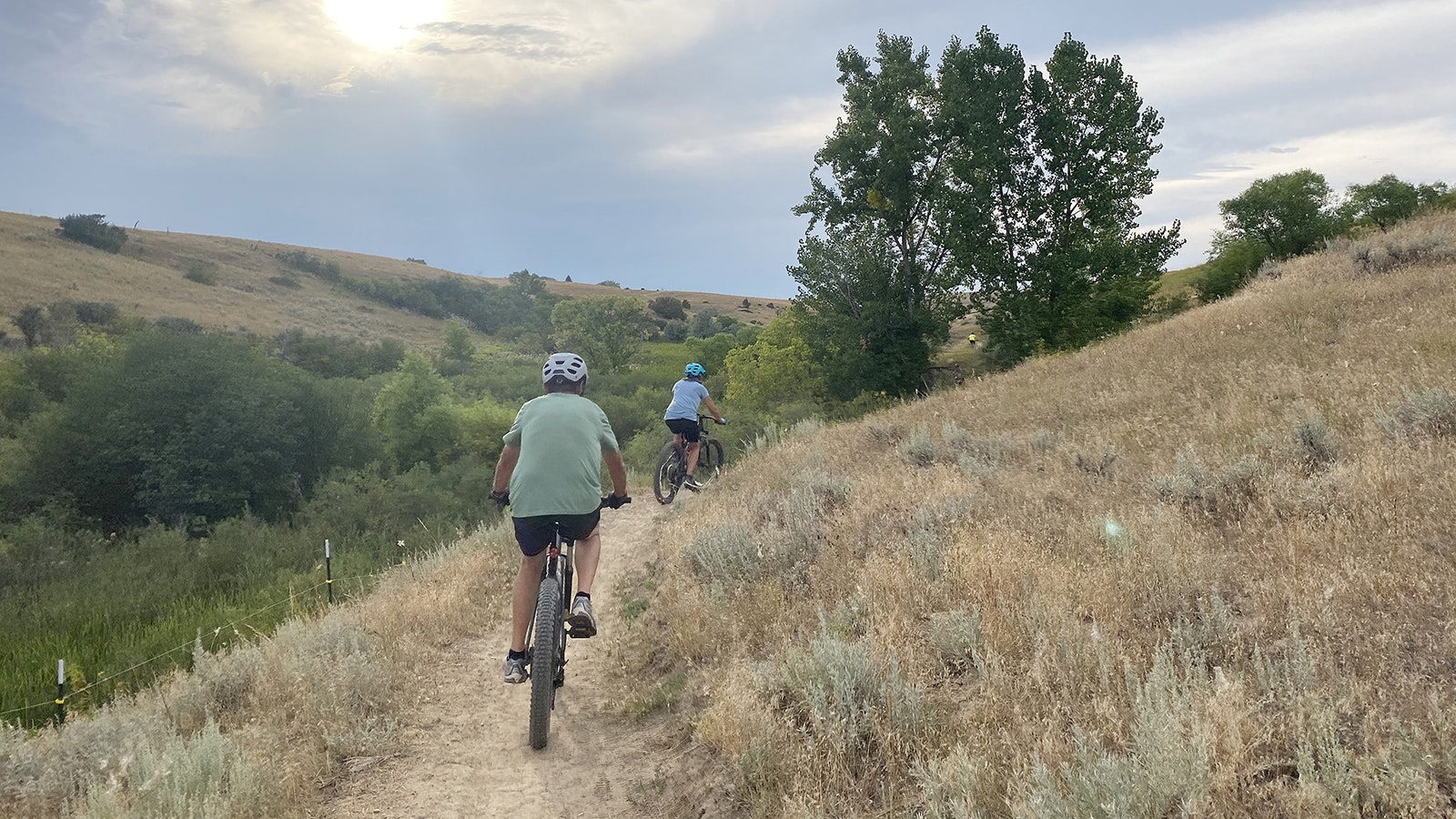 Two mountain bikers ride Hidden Hoot Trail, one of the segments of trail added to Soldier Ridge Trail.