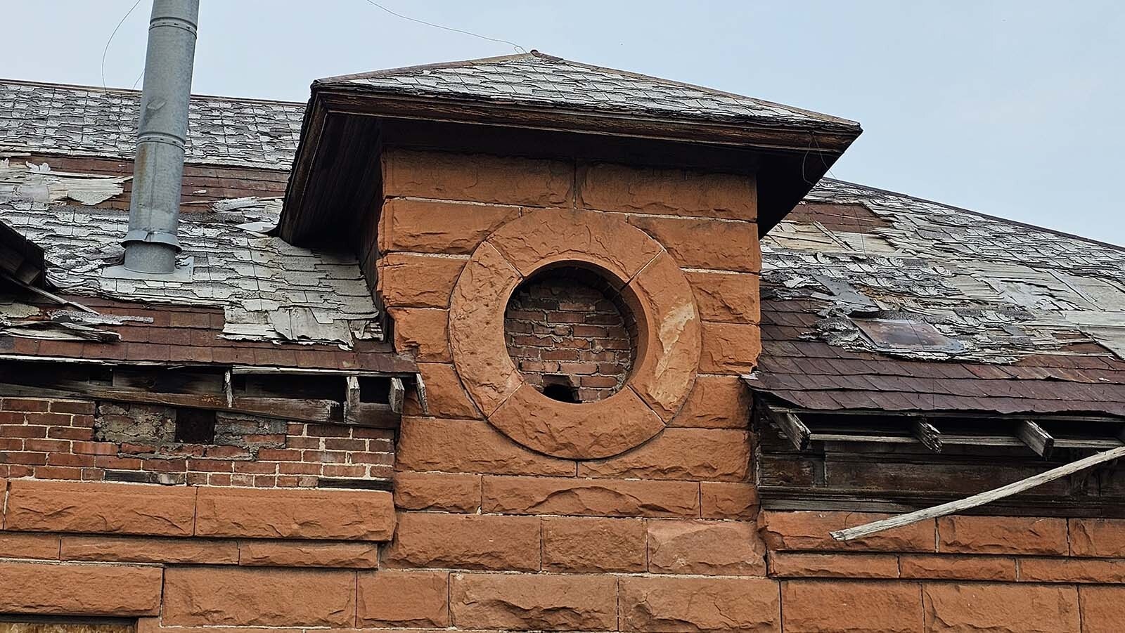 This circular "window" actually wasn't a window at all. It was for venting smoke, and there used to be an associated smokestack that stood 80 feet or so tall.