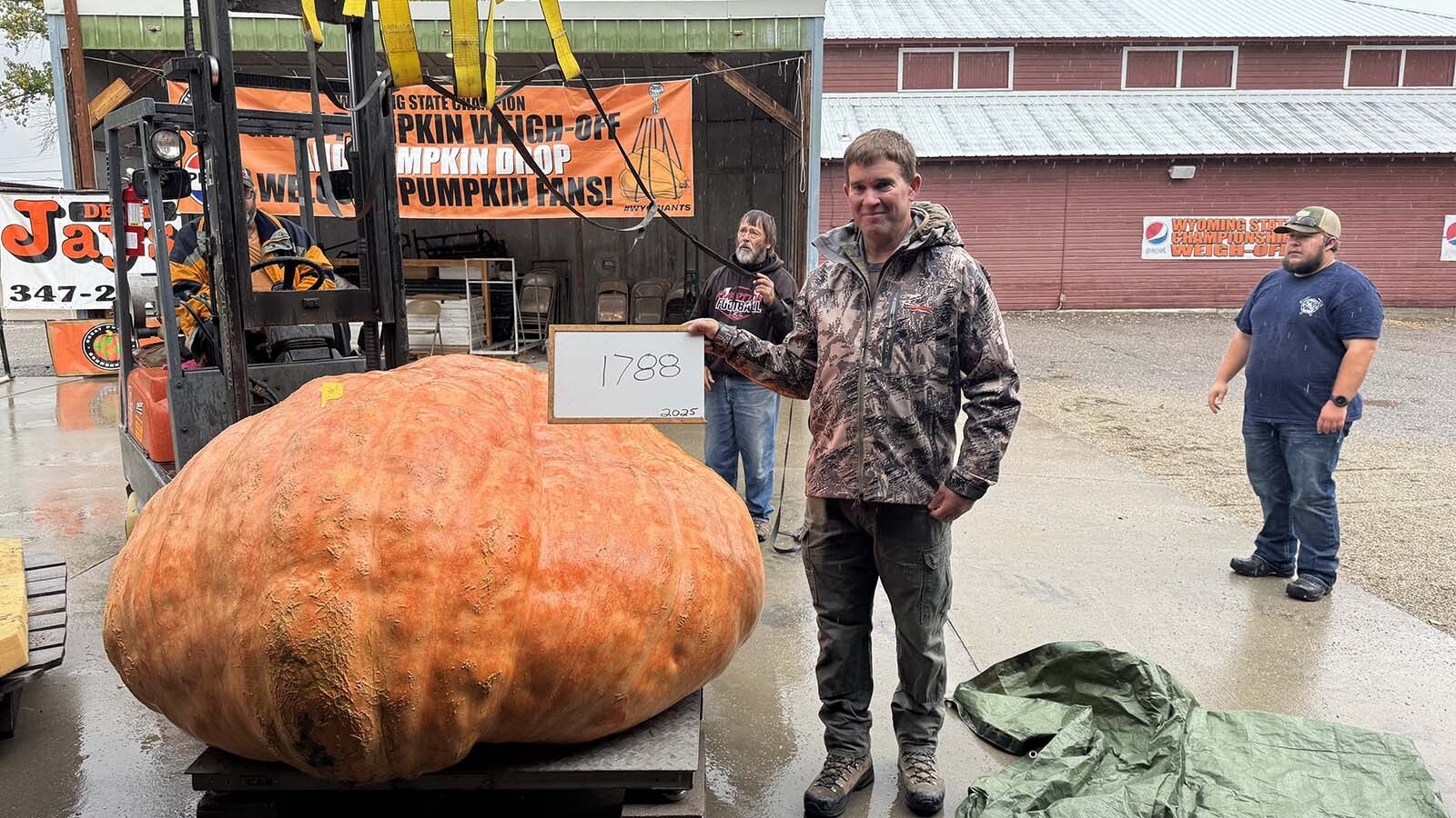 Chad Kurtenbach with his weigh-off winning pumpkin at the 2025 Wyoming Weigh-Off and Pumpkin Drop in Worland.