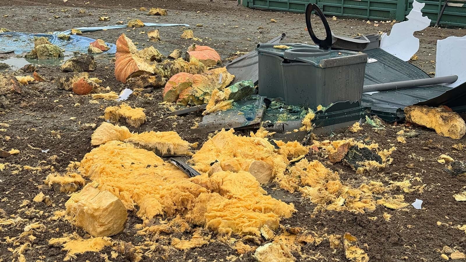 The aftermath of when Chad Kurtenbach’s 1,788-pound pumpkin crushed a porta-potty at the 2025 Wyoming Weigh-Off and Pumpkin Drop in Worland. Kurtenbach has been growing this giant gourd in his backyard in Lovell since June.