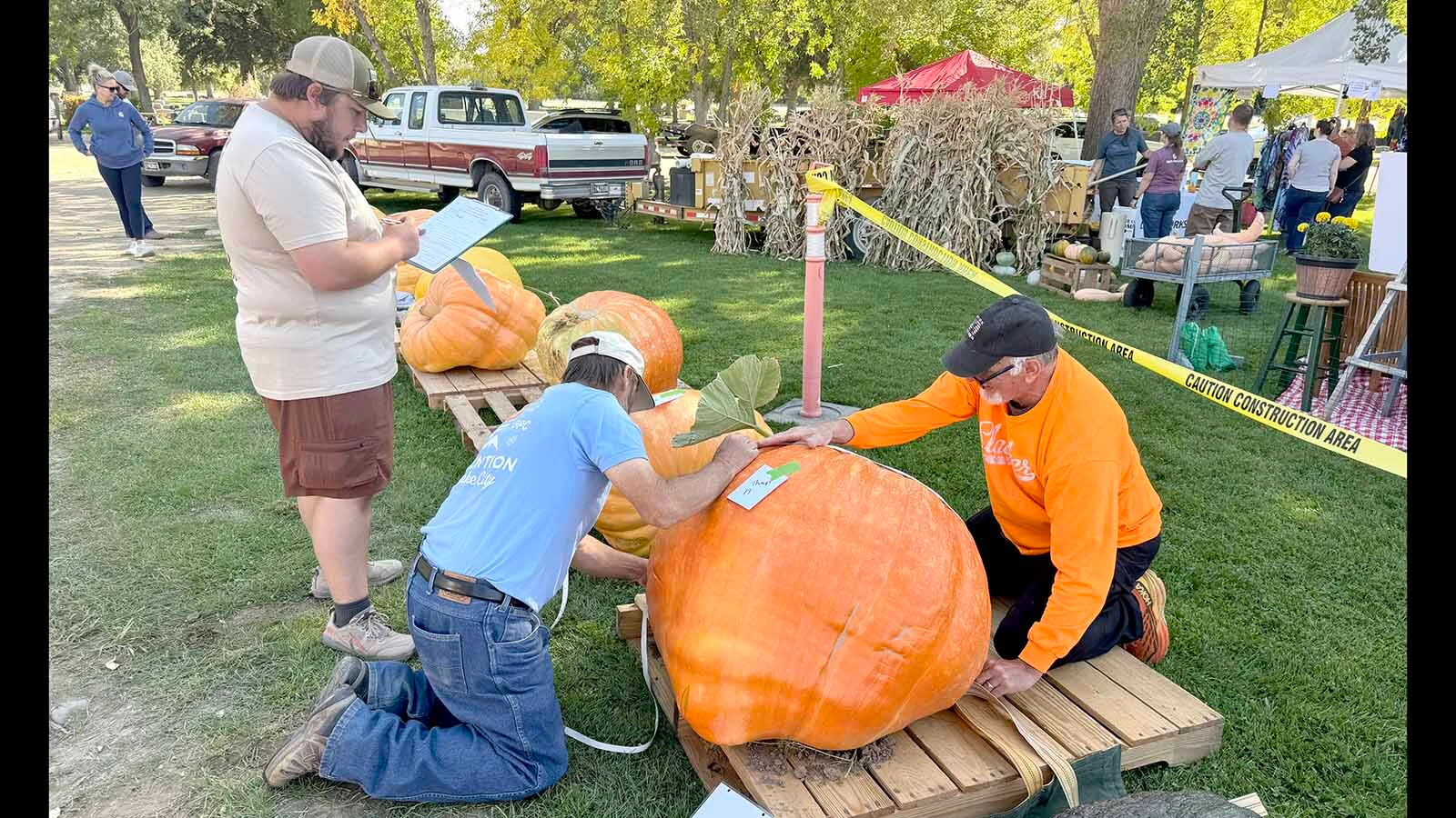 Volunteers estimate the weight of a pumpkin at the 2026 Wyoming State Champion Weigh-off and Pumpkin Drop in Worland. 36 pumpkins were brought to the Washakie County Fairgrounds this year, making it the biggest weigh-off in Wyoming's history.