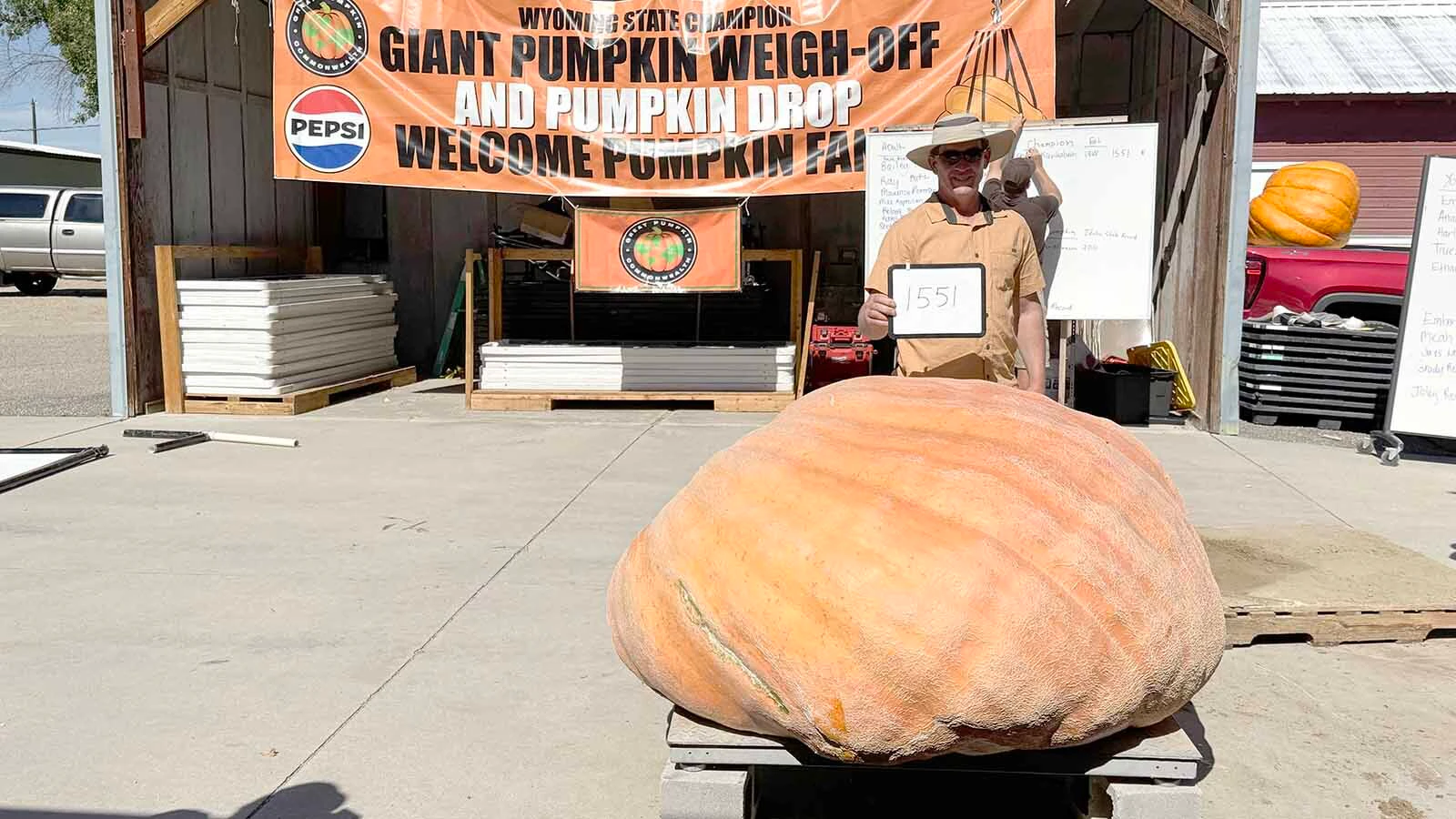 Chad Kurtenbach of Lovell with his 1,551-pound pumpkin at the 2026 Wyoming State Champion Weigh-Off and Pumpkin Drop. This was Kurtenbach's second consecutive win.