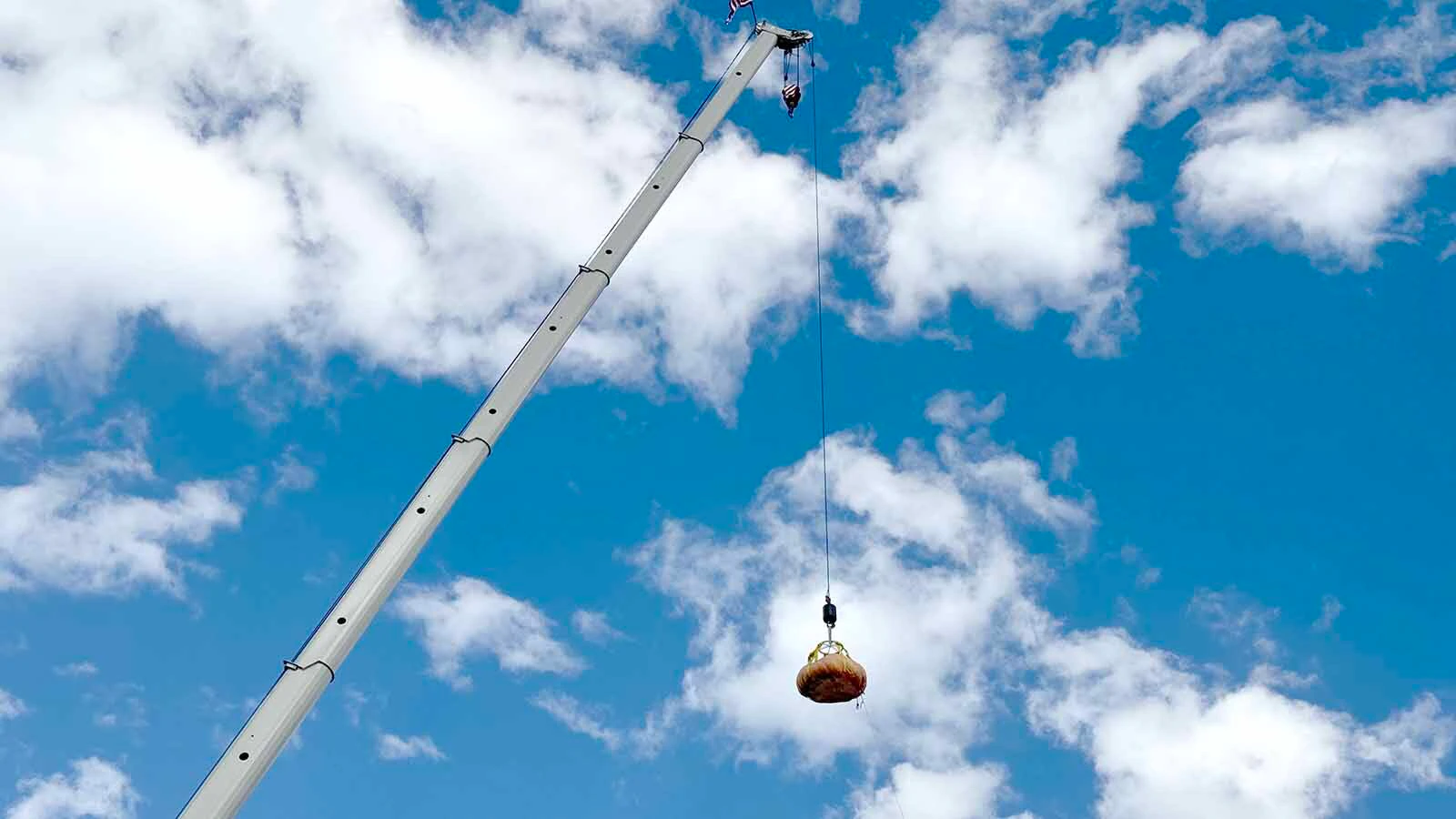 A 1,551-pound pumpkin moments before dropping 200 feet to the ground at the 2026 Wyoming State Champion Weigh-Off and Pumpkin Drop in Worland. This pumpkin, grown by Chad Kurtenbach of Lovell, won this year's weigh-off.
