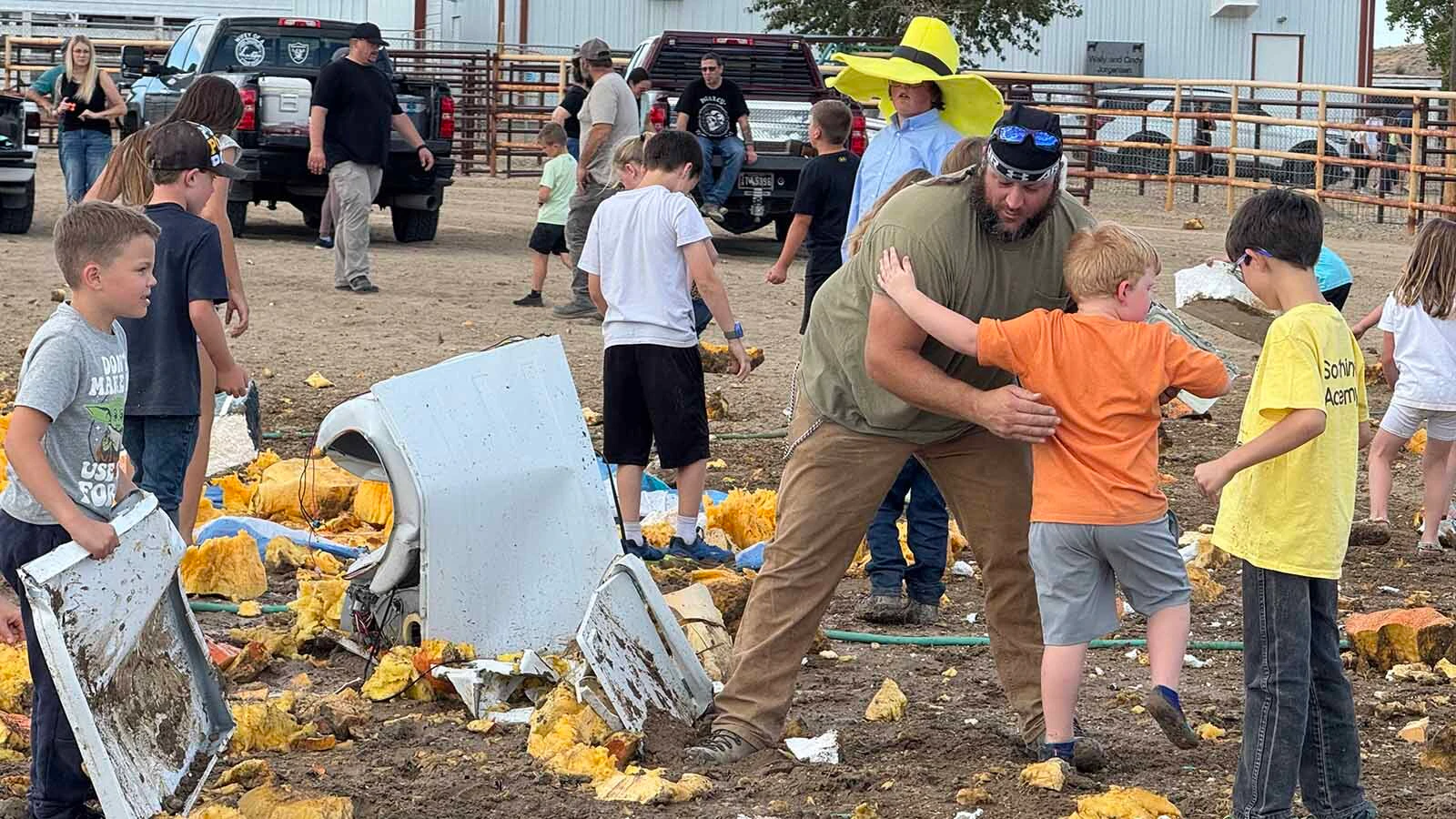 Kids scatter and collect pumpkin seeds in the aftermath of the pumpkin drop at the 2026 Wyoming State Champion Weigh-Off and Pumpkin Drop in Worland.