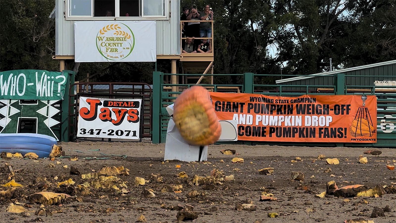 Chunks of pumpkin litter the Washakie County Fairgrounds arena in Worland as a giant squash obliterates an old clothes dryer when dropped from 200 feet Saturday, Sept. 26, 2026, at the Wyoming State Weigh-Off and Pumpkin Drop in Worland.