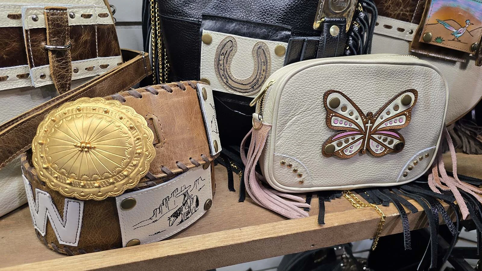 Pure Dixie is known for its a 3-step customizing process. Pick a larger purse, add a belt, then choose a sidewinder bag. The removable patches, meanwhile, can change the appearance of a bag on a moment's notice, dressing up or down for any occasion or mood.