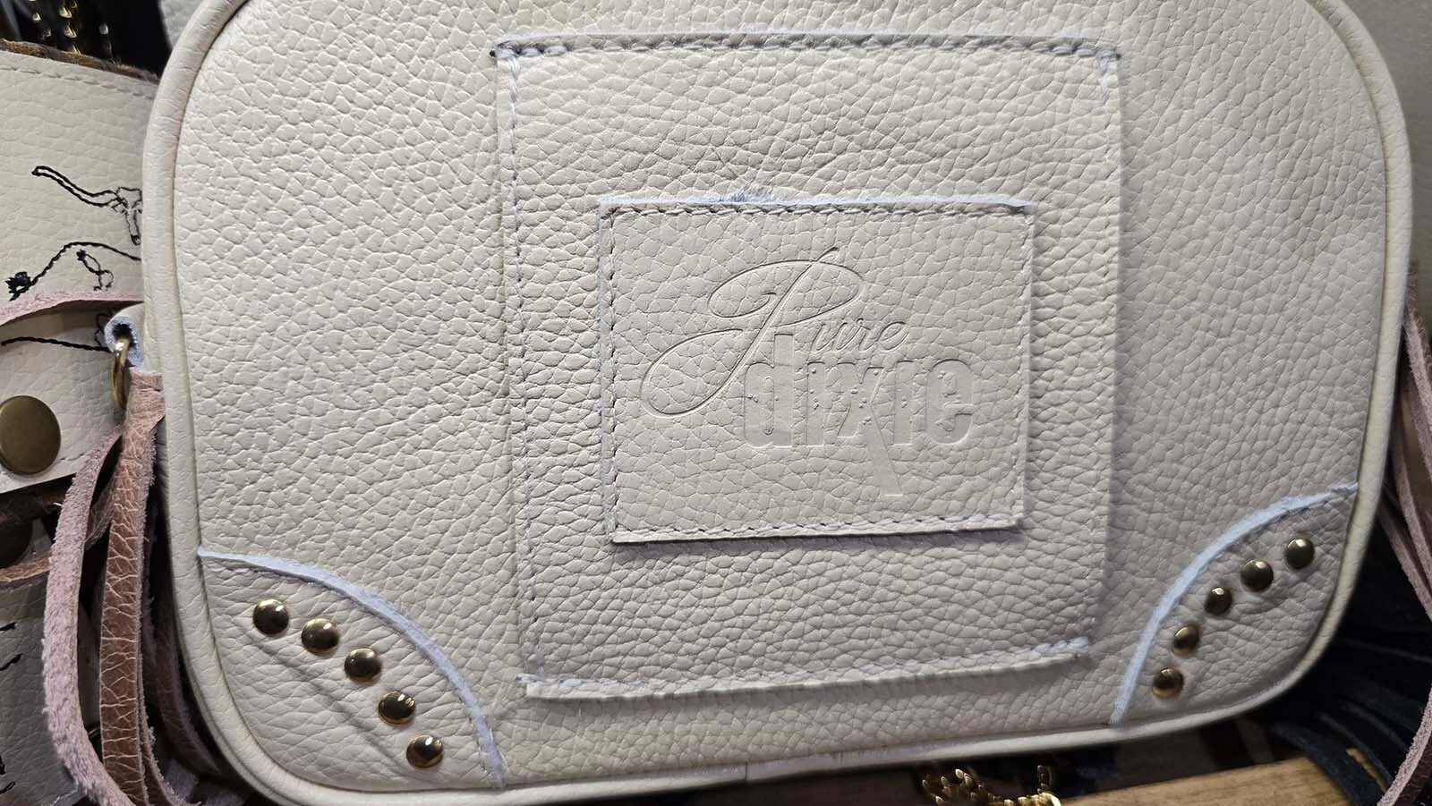 This leather sleeve is how the sidewinder bags and purses attach.
