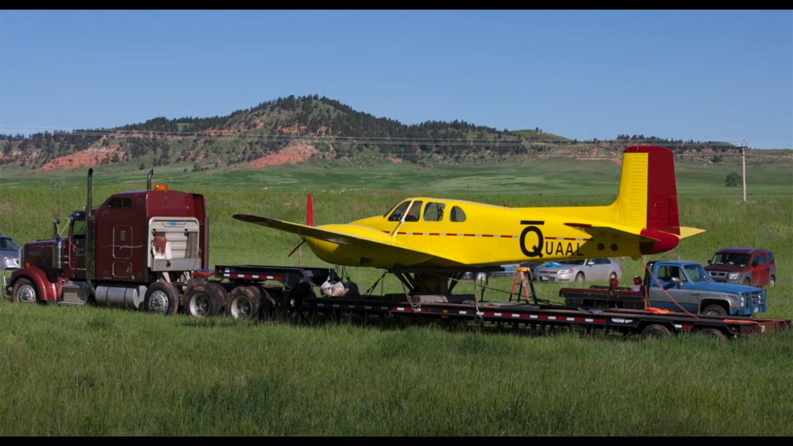 A truck moves the vintage Beechcraft Twin Bonanza plane into position to be placed on a pole as a wind sock nine years ago.