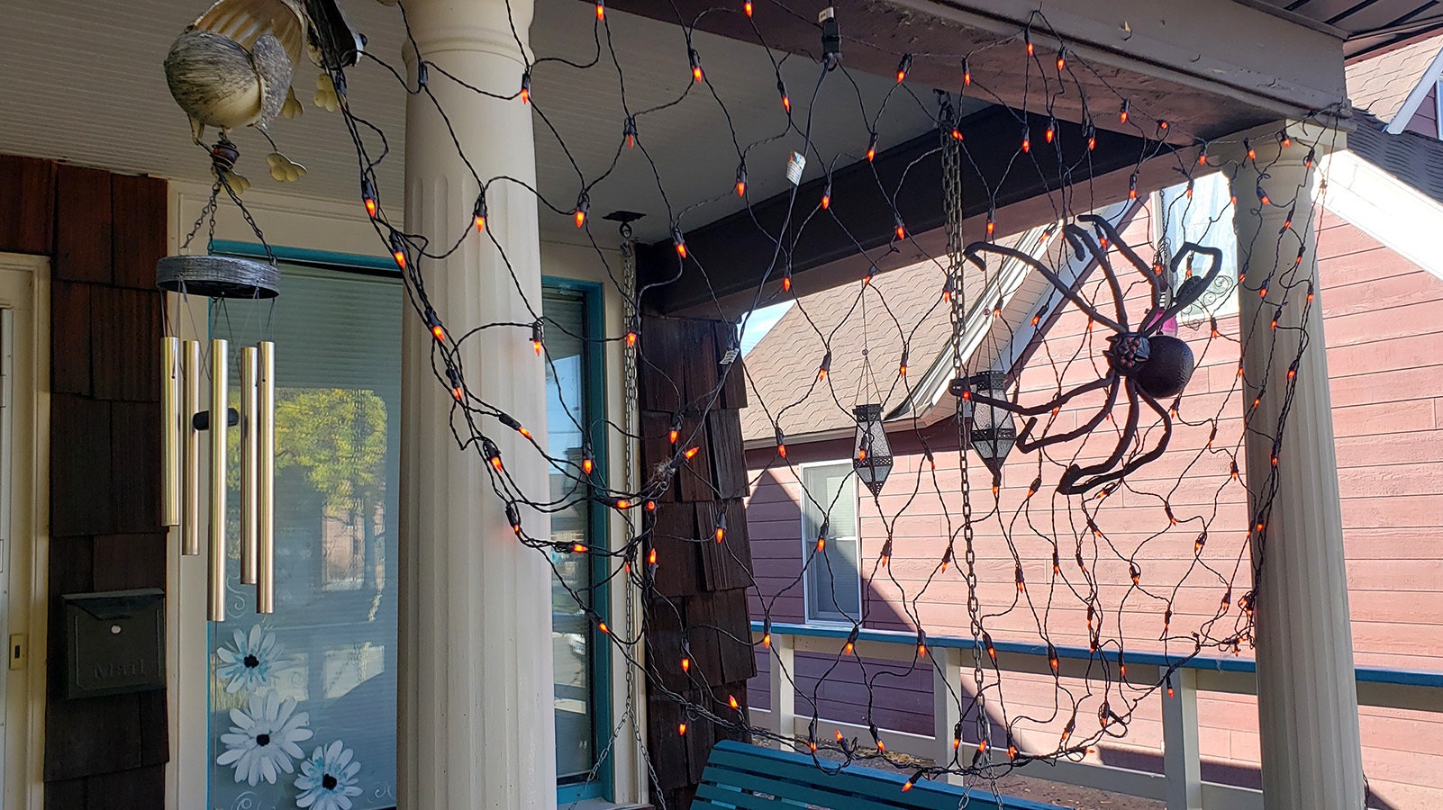 A net of lights forms a spiders web at Desiree Ross' home in Worland, which was the town's first hospital.