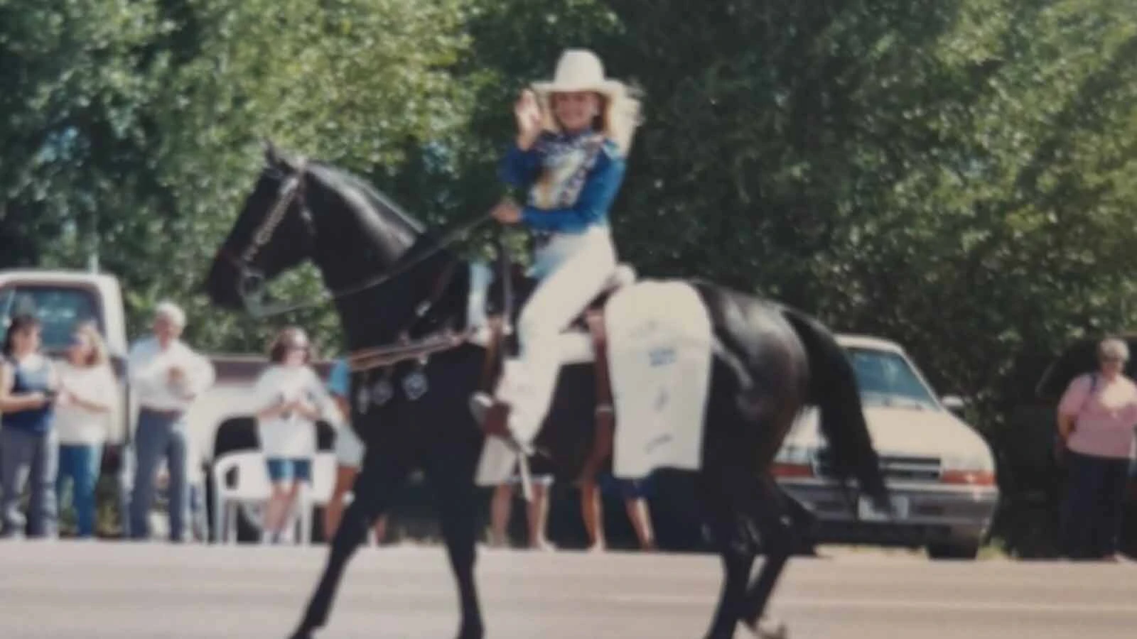 Lisa Borino rides during a parade as part of her years representing Evanston Cowboy Days rodeo royalty. She became Cowboy Days Queen in 1994, 26 years after her mother.