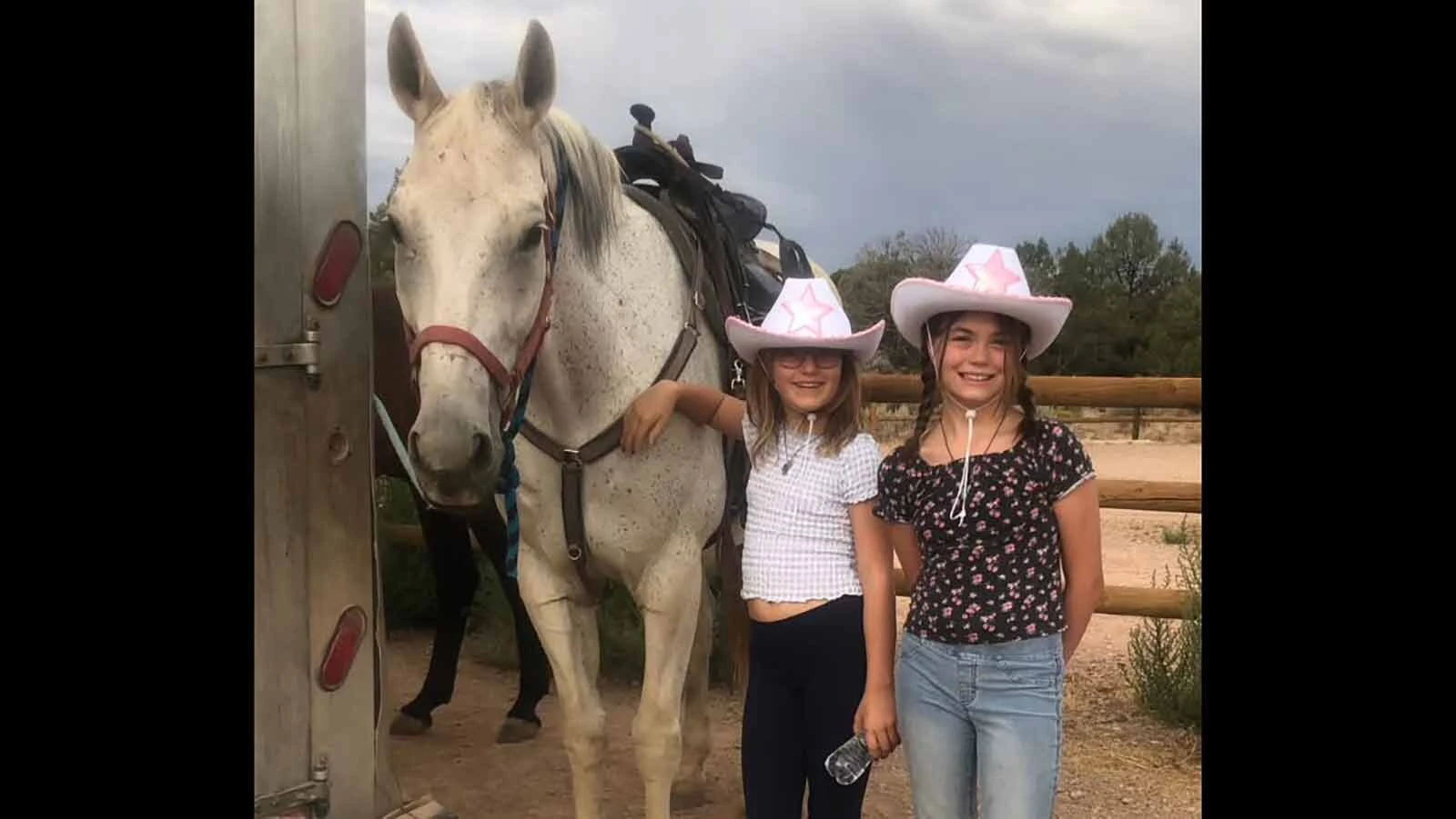 Carriellen Mower, right, poses with another young rider and their horse.