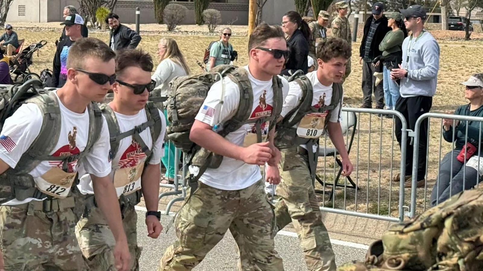 Lugging 35-pound backpacks over the course of a full marathon, UW ROTC cadets Justin Stiles, from left, Louis Torres, Ryan Engle and Jack Harrington finished in 16th place at the Bataan Memorial Death March competition.