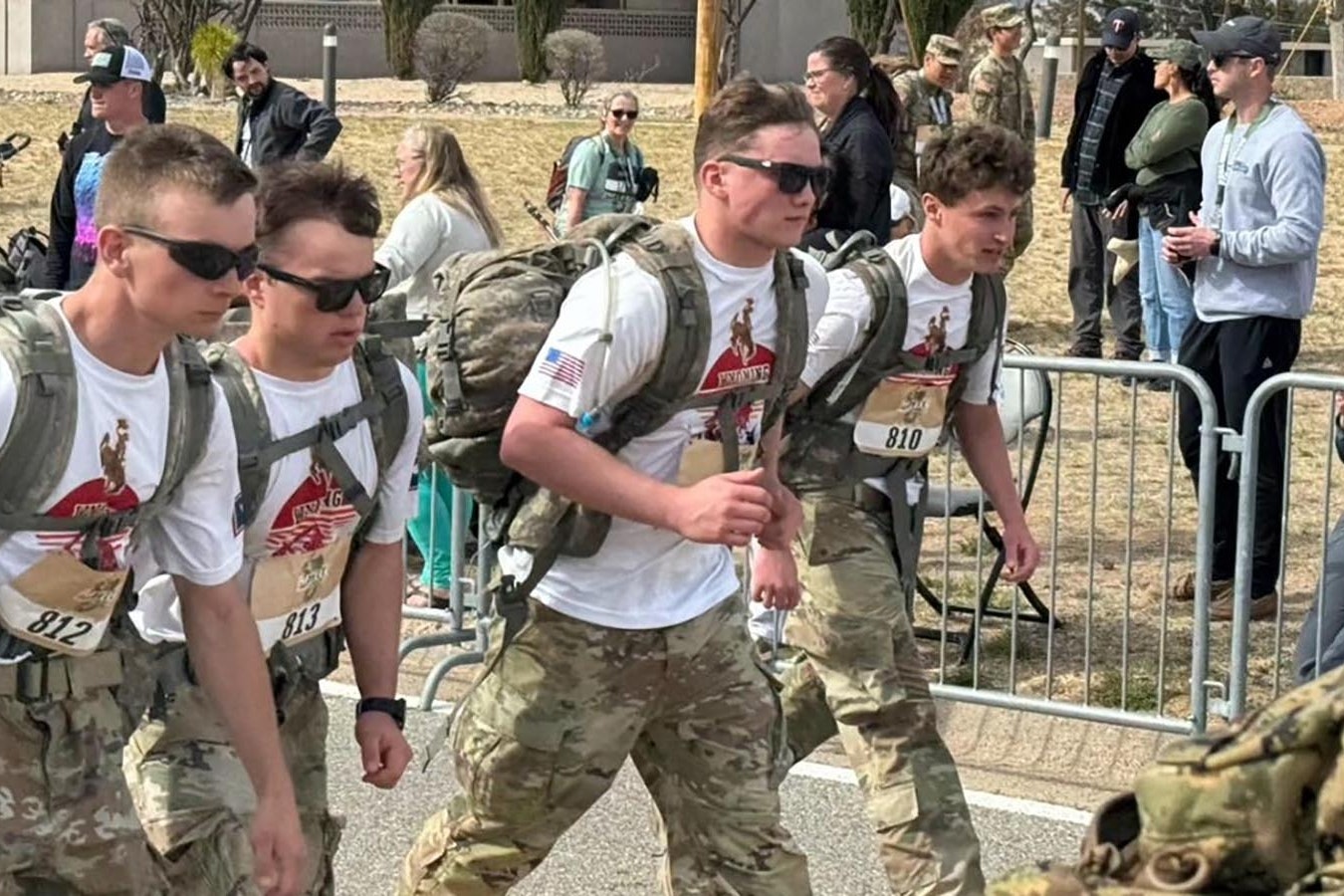 Lugging 35-pound backpacks over the course of a full marathon, UW ROTC cadets Justin Stiles, from left, Louis Torres, Ryan Engle and Jack Harrington finished in 16th place at the Bataan Memorial Death March competition.
