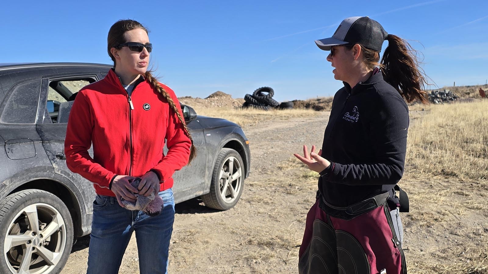 Kate Anderson left, and Meghan McGann discuss next steps for horse care at her ranch in Chugwater.