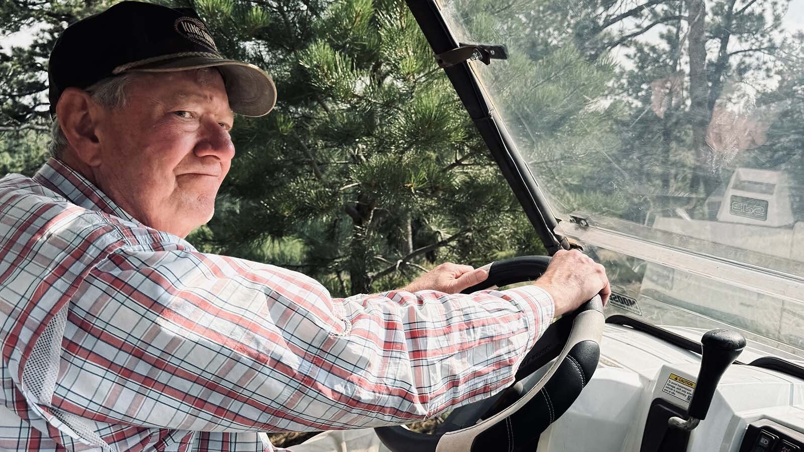 John Davis regularly drives his Polaris Ranger to navigate around some of the steep hills in the countryside of the Fish Creek Ranch Preserve that overlooks the Laramie Plains. A Spanish energy company wants to build a 500-megawatt wind farm in the area.