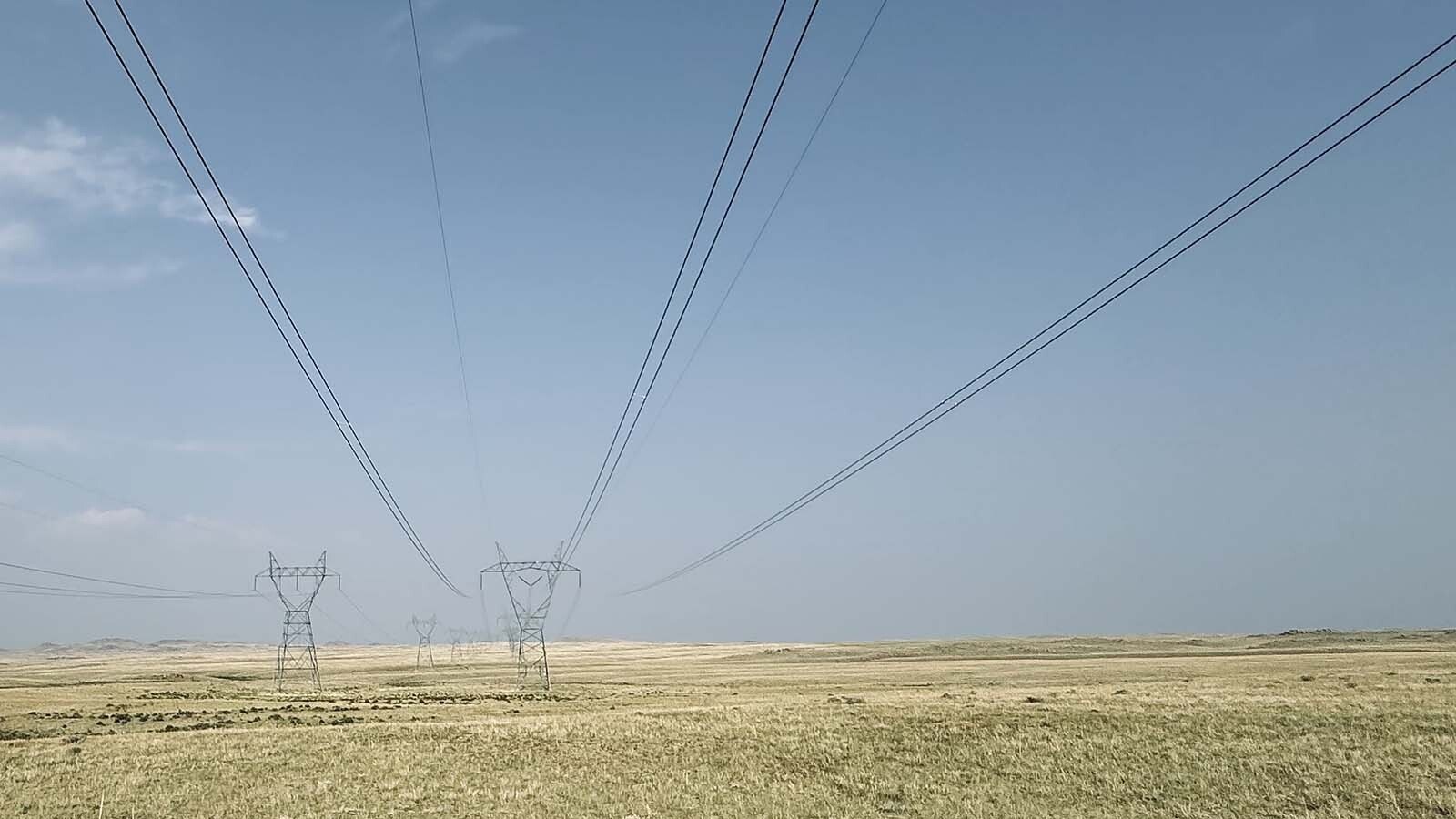 Above, a Spanish energy company wants to connect its proposed 500-megawatt wind farm with the 345-volt Ault-Craig transmission lines seen in the distance along the Laramie Plains. The lines are owned by the Western Area Power Administration, or WAPA, which is a western United States power marketer with the Department of Energy.