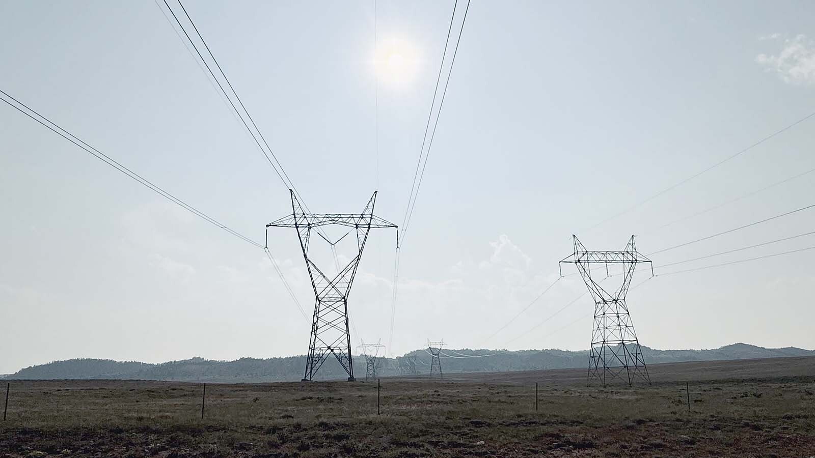 Above, a Spanish energy company wants to connect its proposed 500-megawatt wind farm with the 345-volt Ault-Craig transmission lines seen in the distance along the Laramie Plains. The lines are owned by the Western Area Power Administration, or WAPA, which is a western United States power marketer with the Department of Energy.