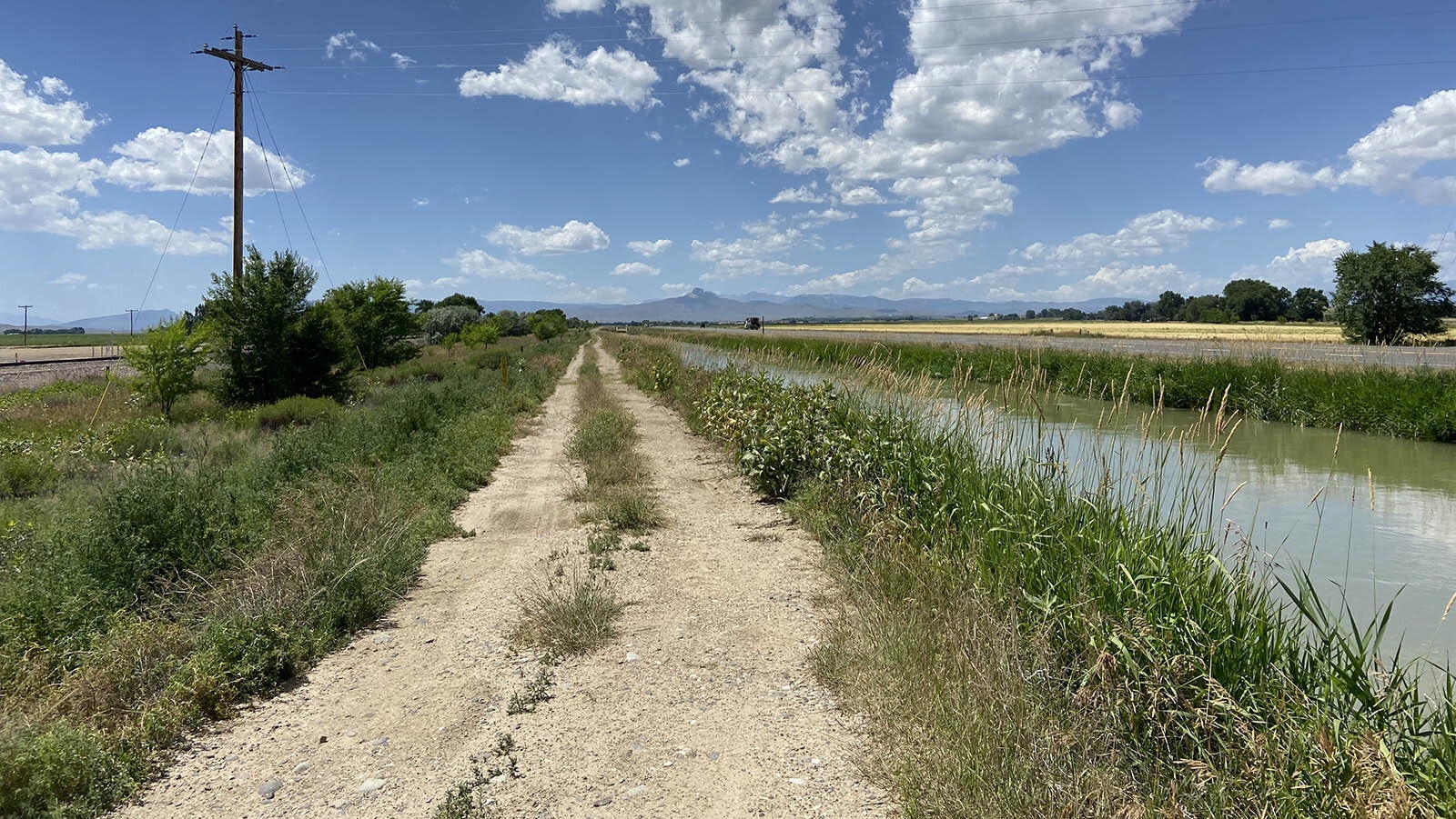 A proposed 25-mile trail route from Powell to Cody, Wyoming, follows an active railroad on one side and a canal on the other.