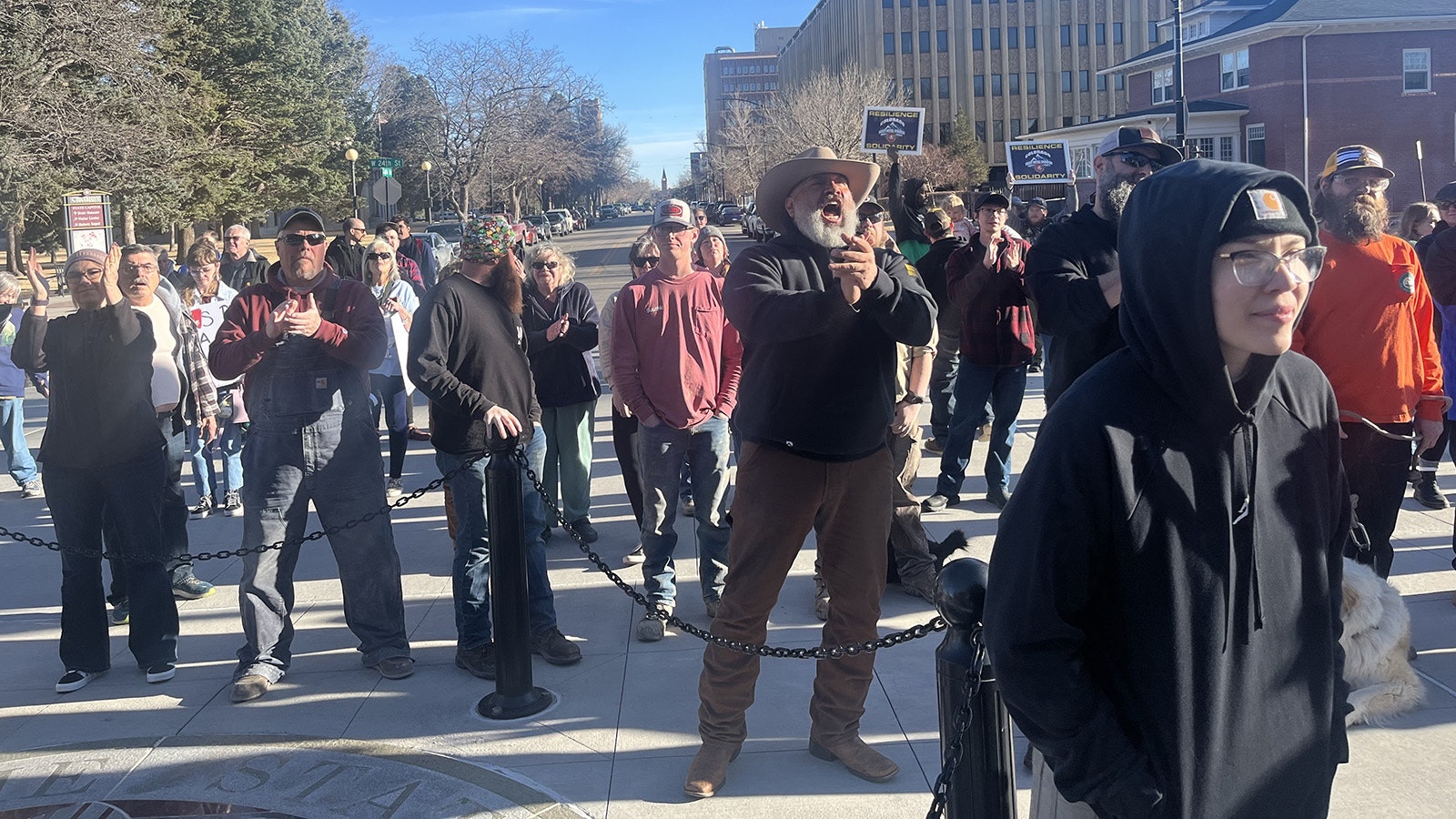 Around 150 Wyoming workers gathered outside the Capitol on Friday to protest moves by the Wyoming Legislature and Trump administration cuts.