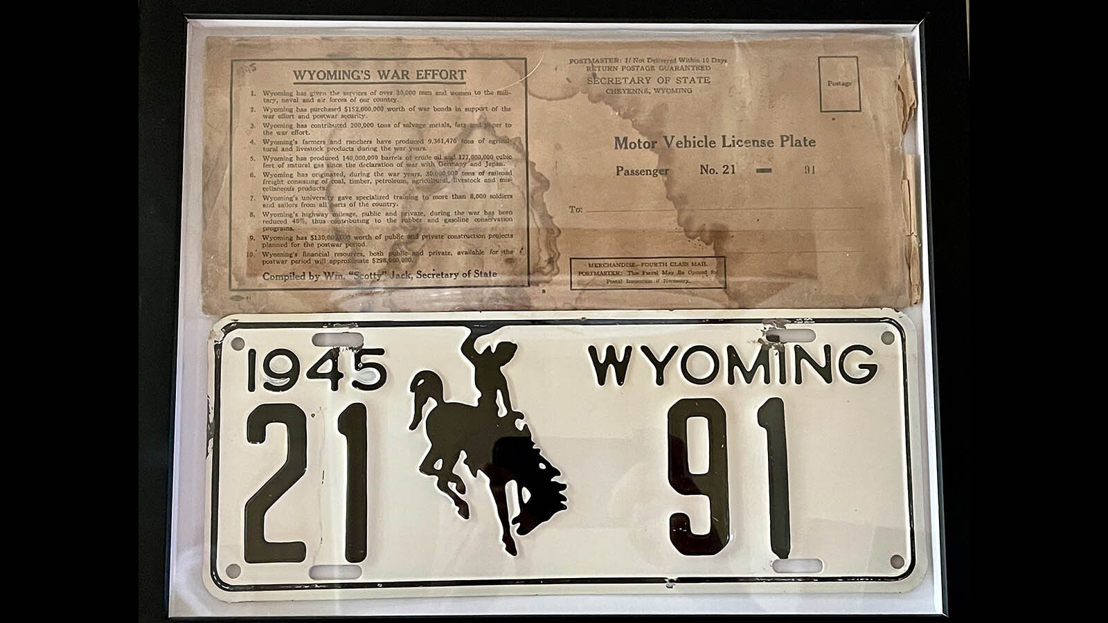 A rare 1945 Wyoming license plate with its original wrapper is part of Collin Townsend's collection of plates from nearly every year.