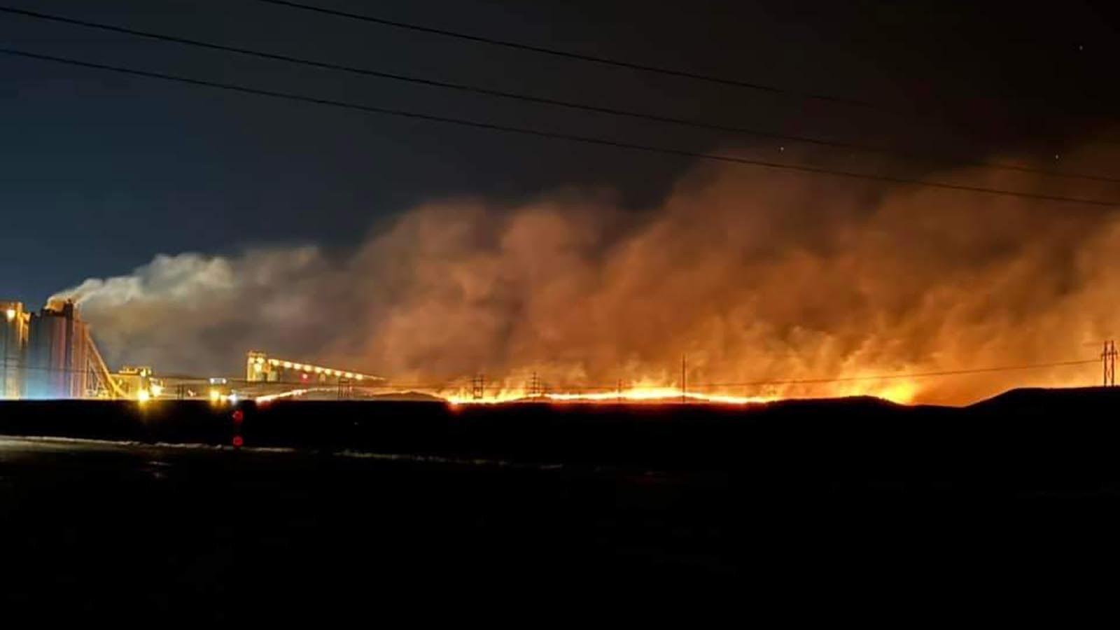 A fire burns near a coal silo Sunday night, Sept. 1, 2024, at the Rawhide mine north of Gillette.