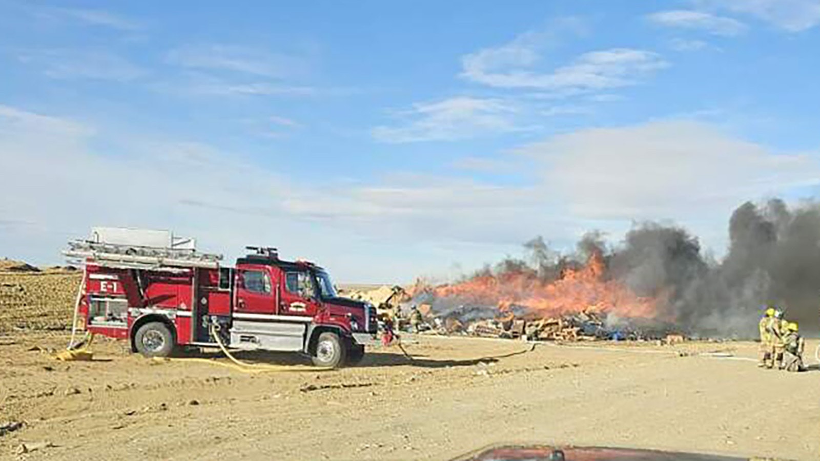 Firefighters work to knock down a large fire that broke out in the construction and demolition section of the Rawlins Landfill on Saturday afternoon.