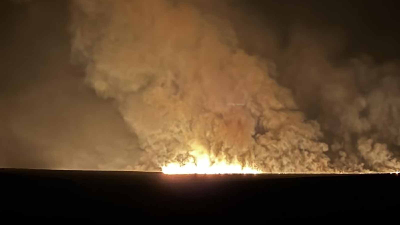 The Red Canyon Fire advances overnight Friday on the south side of Buffalo Creek Road.