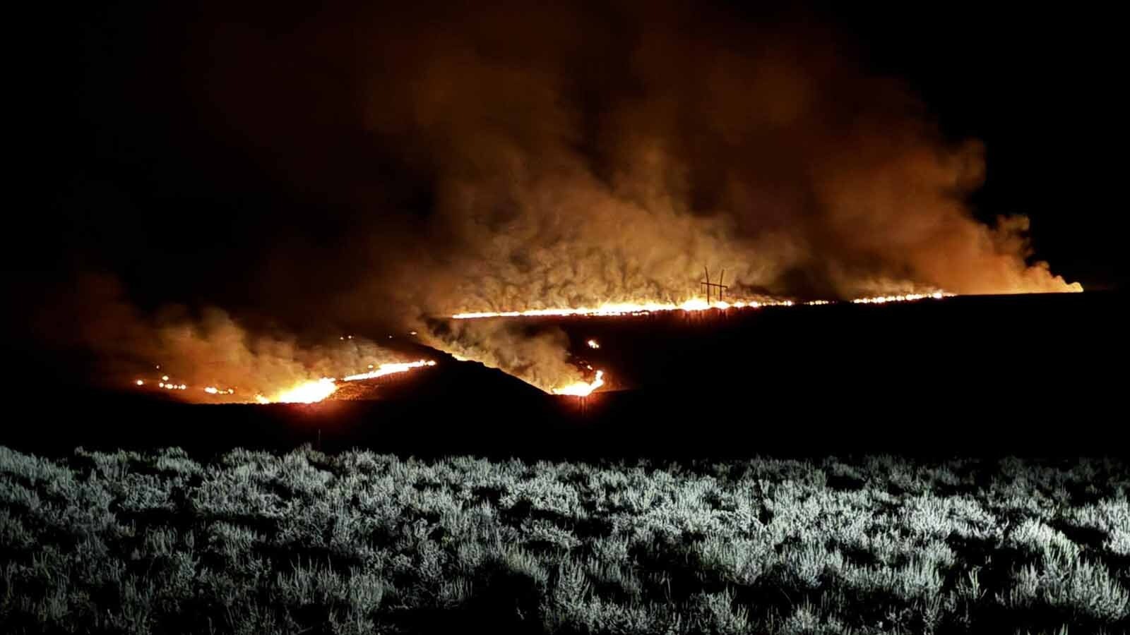 The Red Canyon Fire advances overnight Friday on the south side of Buffalo Creek Road.