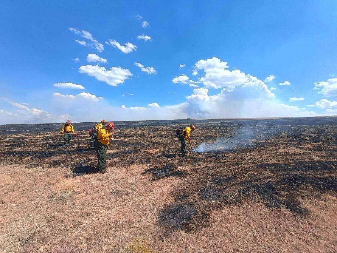 Crews from the Albuquerque, New Mexico-based Redwood Fire unit work the lines of the Red Canyon Fire.
