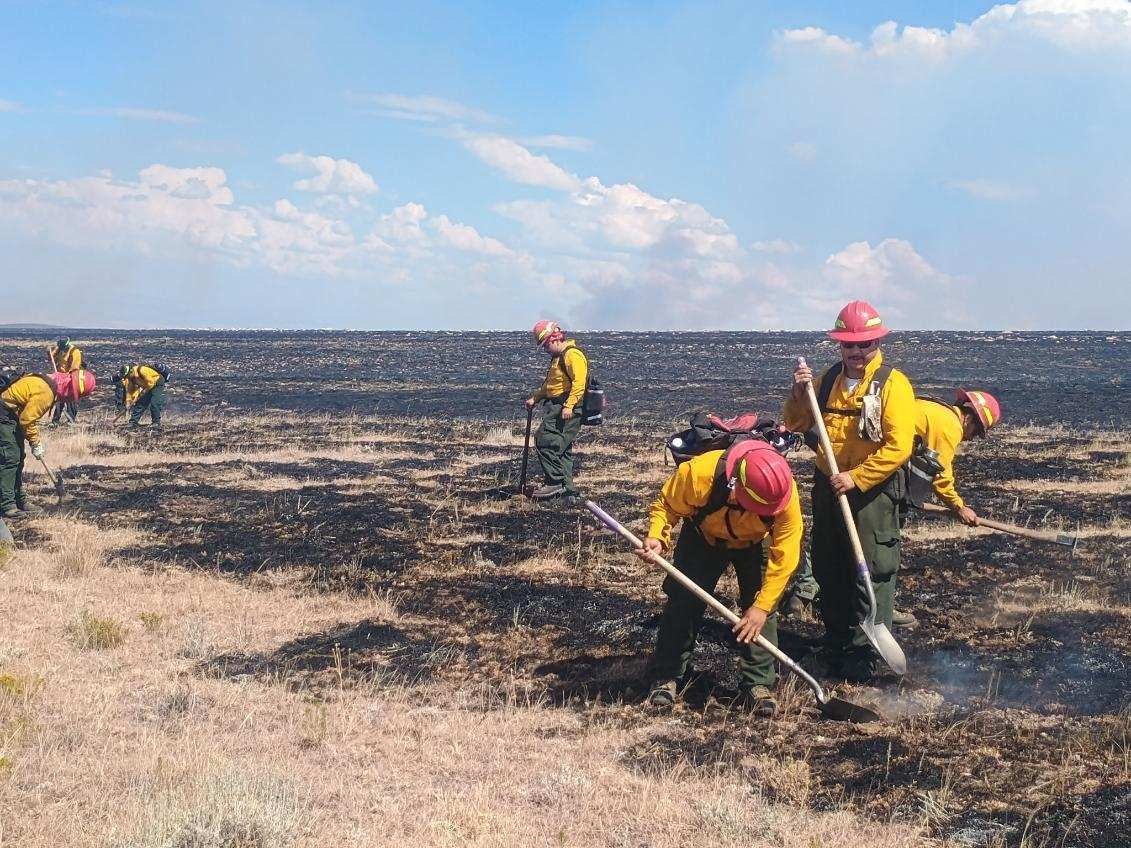 Crews from the Albuquerque, New Mexico-based Redwood Fire unit work the lines of the Red Canyon Fire.