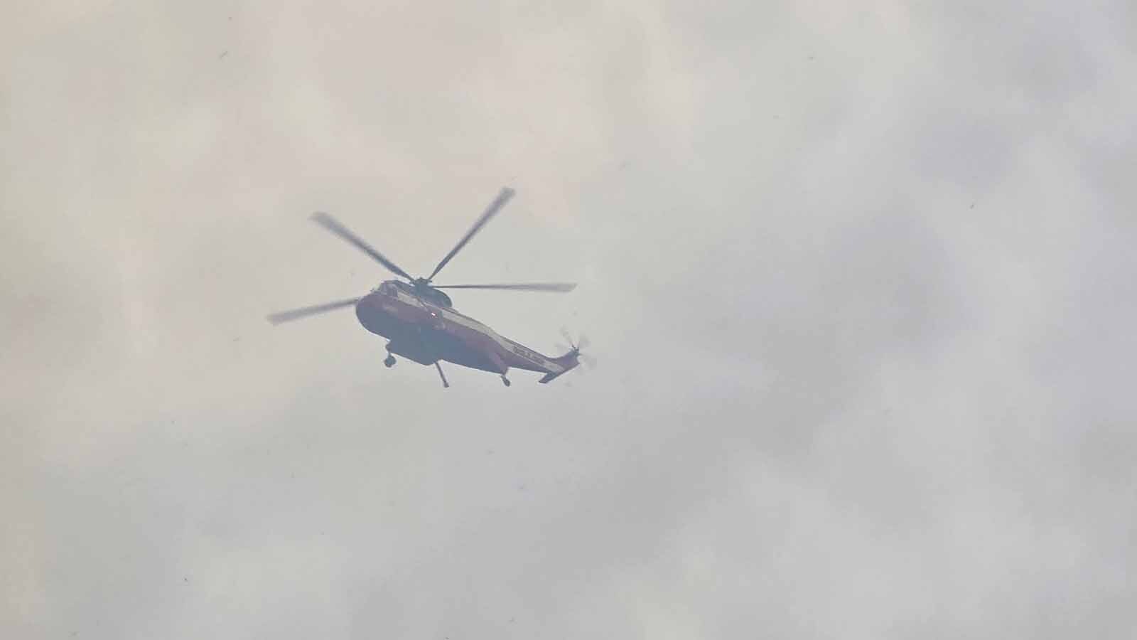 Air support has been dropping water and fire retardant on the Red Canyon Fire since Friday. Grateful ranchers often pause from fighting the blaze to watch the drops.