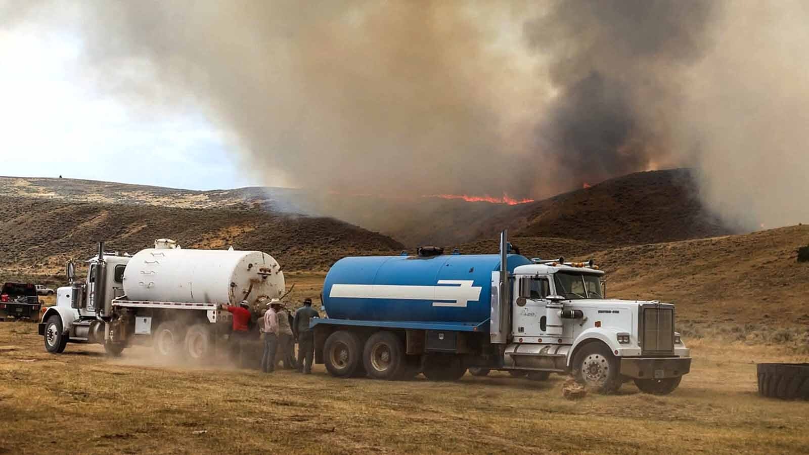 Civilian tankers and heavy equipment have been deployed to help fight the Red Canyon Fire that is raging unconfined across rural Hot Springs County. More than 100,000 acres of rangeland has been destroyed since the fire started last Wednesday. Ranchers are concerned for their cattle who have lost their winter, spring and fall feed.
