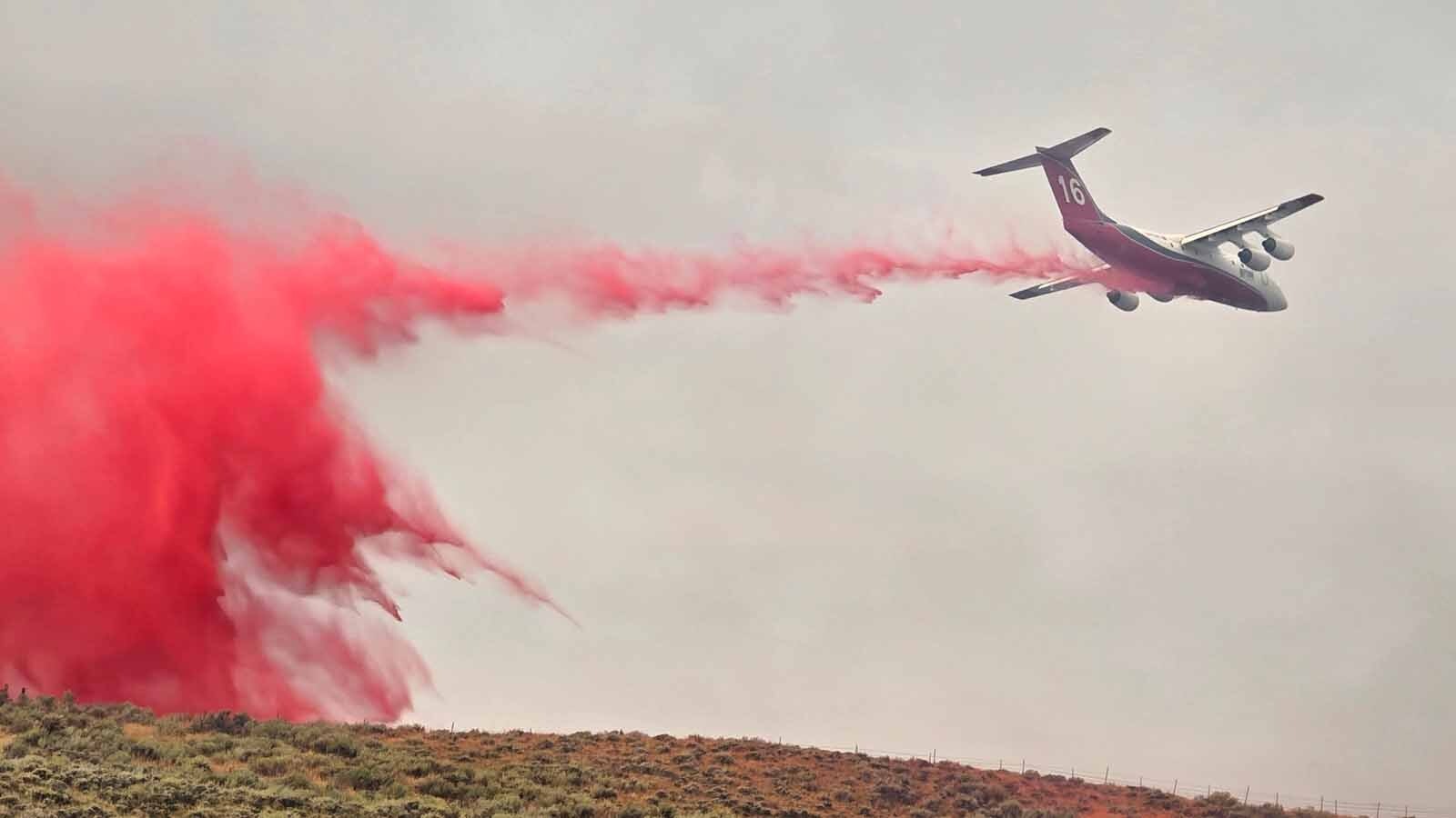 Air support has been dropping water and fire retardant on the Red Canyon Fire since Friday. Grateful ranchers often pause from fighting the blaze to watch the drops.