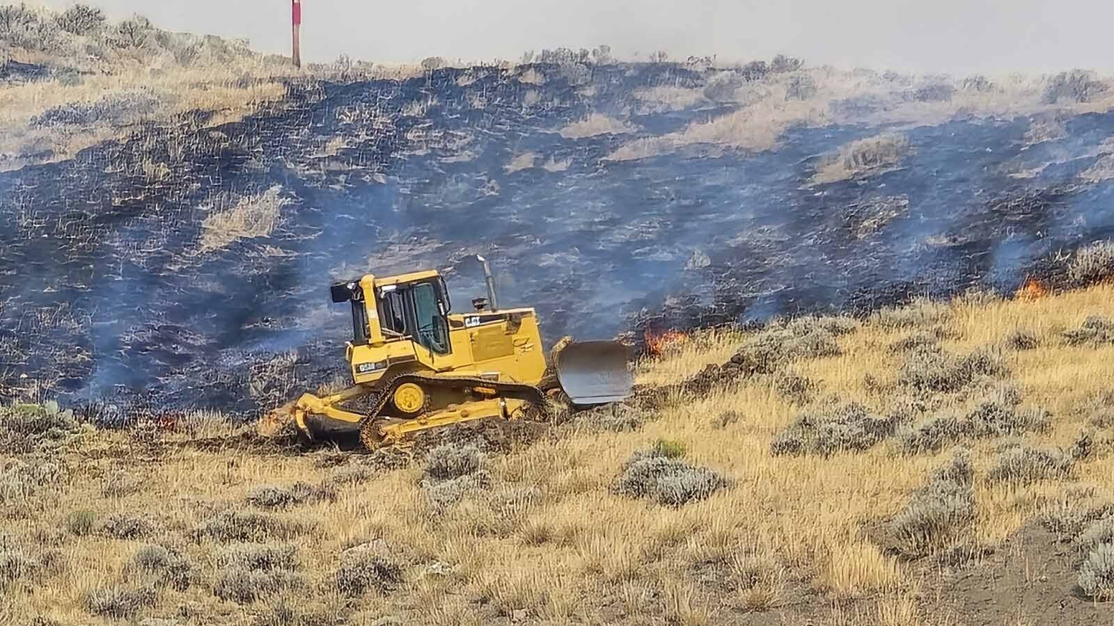 Heavy equipment has been brought in to cut deep fire lines in the earth to stop the Red Canyon Fire from spreading. Unfortunately, high winds, dry grass and hot temperatures have created a dangerous situation and most of the fire breaks have been jumped by the flames.