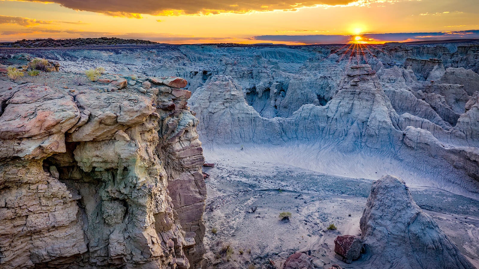 The Red Desert is a high-altitude sagebrush steppe and dry landscape in southwest Wyoming. Among the natural features in the Red Desert region is is Adobe Town. The colorful eroded badlands is a moonscape of rock formations in what is said to be the largest unfenced area in the Lower 48 states. The barren landscape is rarely visited and can receive only 12 inches of rain a year.