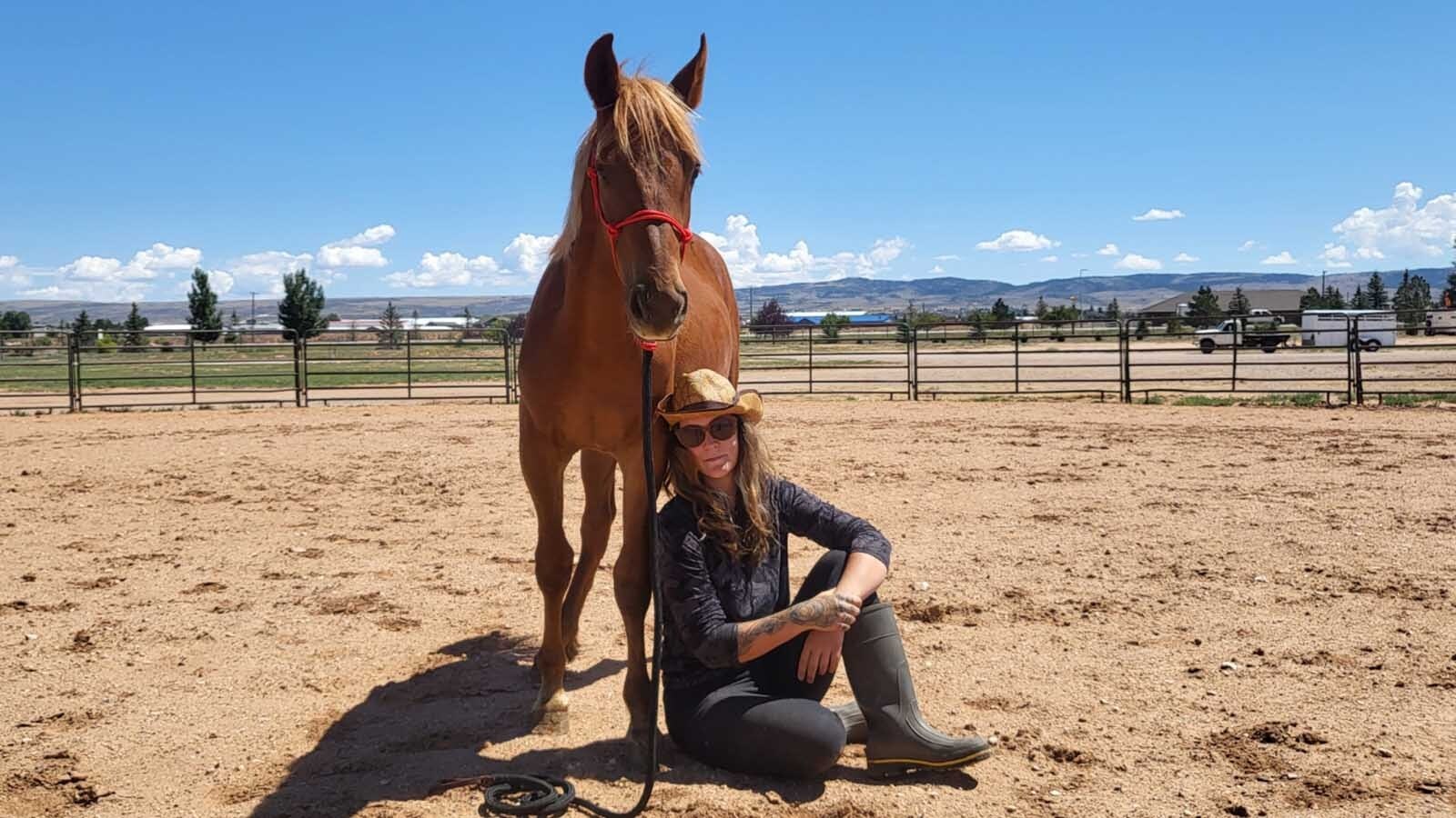 Horse trainer Sienna Hawk has worked with Red Solo Cup — a mustang from Wyoming’s White Mountain wild horse herd — to prepare him for adoption.