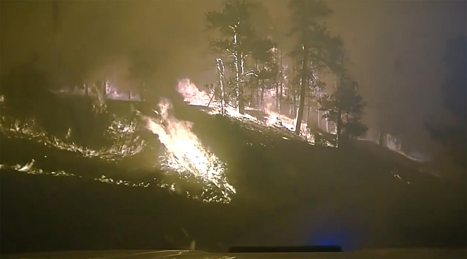 Flames burn right up to the road as a Rosebud County Sheriff's Office sergeant drives southeast on Cow Creek Roqd checking for people that may be in the fire's path. The video quickly goes from a normal, green landscape to an inferno.