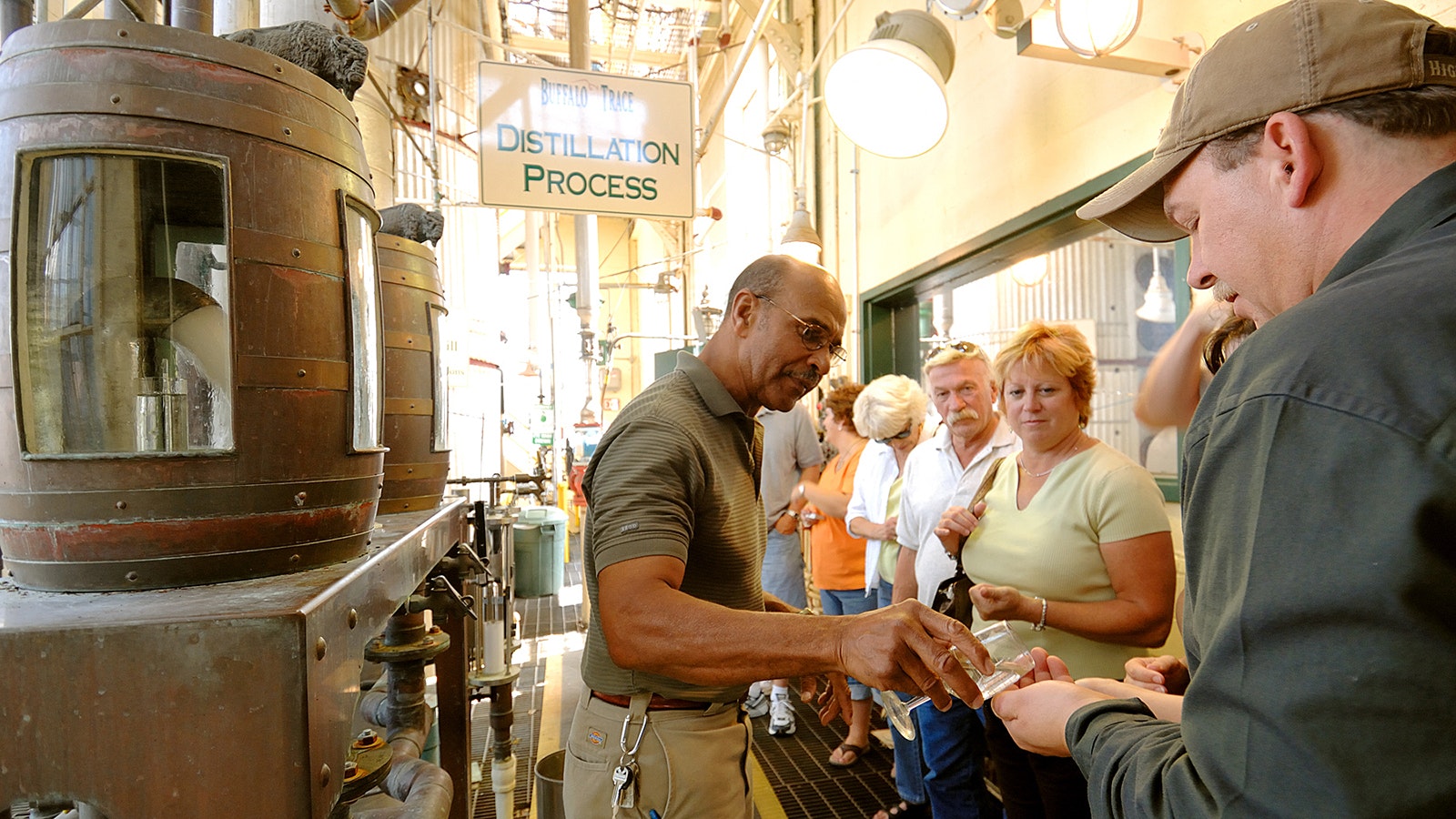Freddie Johnson entertaining folks during a tour of the Buffalo Trace Distillery in Kentucky. He will bring his shtick to Yellowstone National Park’s wilderness in a glass-walled tasting room where the buffalo roam.