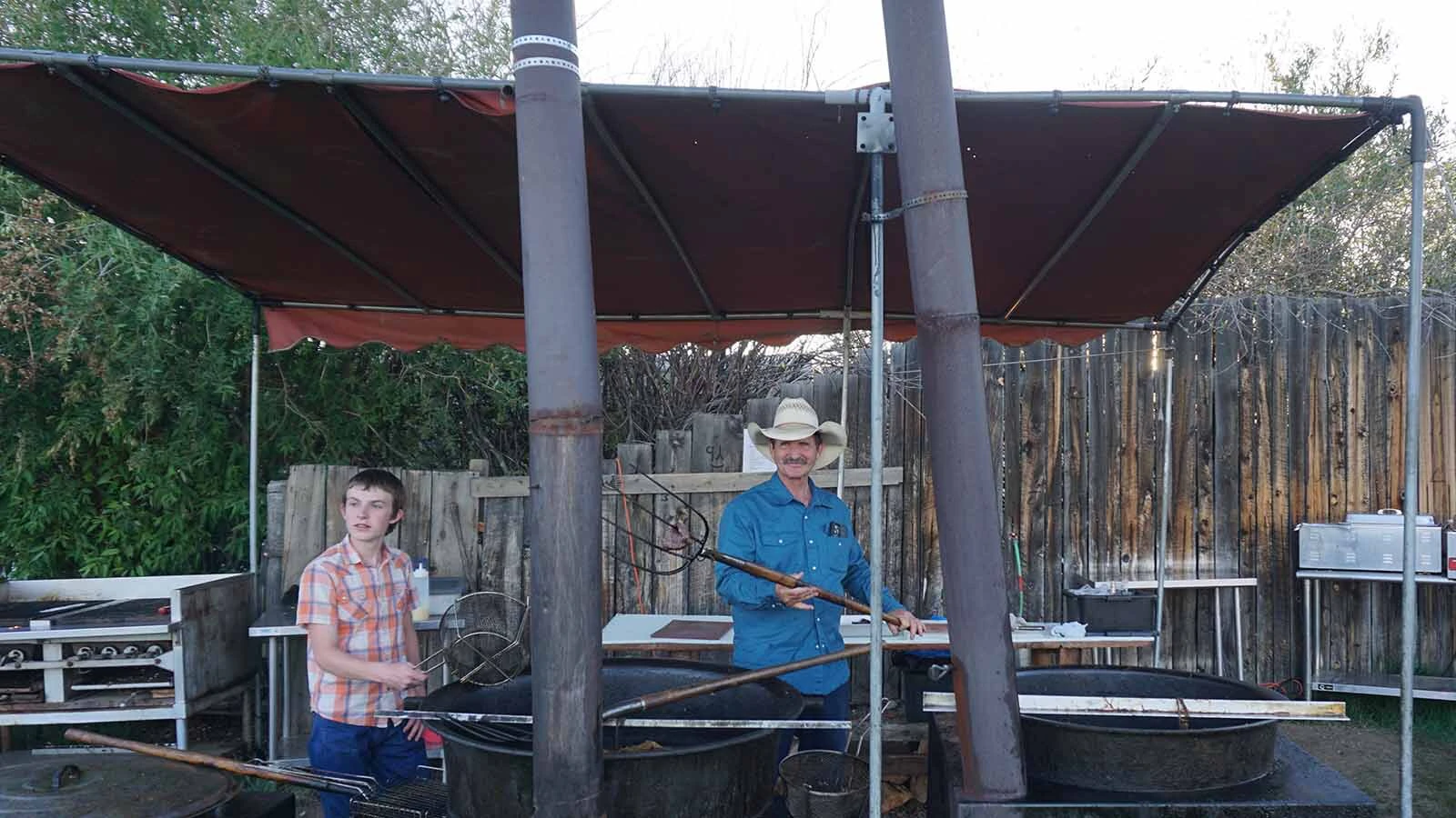Matt David pulls Western cookout cuisine from cauldrons of beef tallow at the Green River Rendezvous.