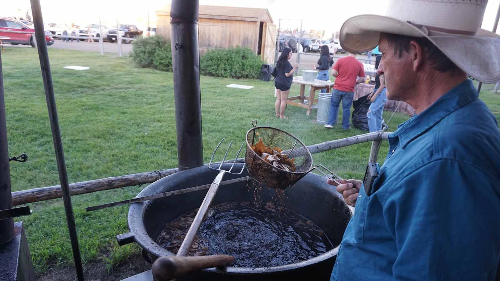 Matt David pulls Western cookout cuisine from cauldrons of beef tallow at the Green River Rendezvous.