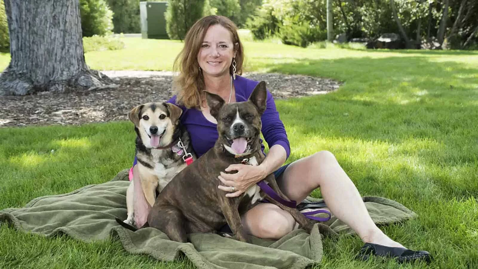 Yola’s Pet Rescue founder JM Marschner is shown with the namesake of her clinic, Yola, and Boogy. Both dogs were adopted by Marschner after a veteran suffering from terminal cancer chose her to adopt them in 2017.