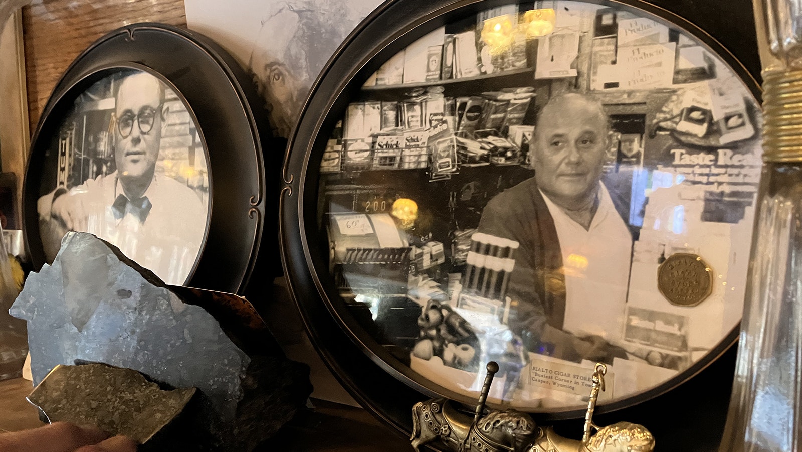Photos that show George Panos as a young and older man are on the shelf. George and his wife, Helen, ran a cigar shop and soda fountain for several years.