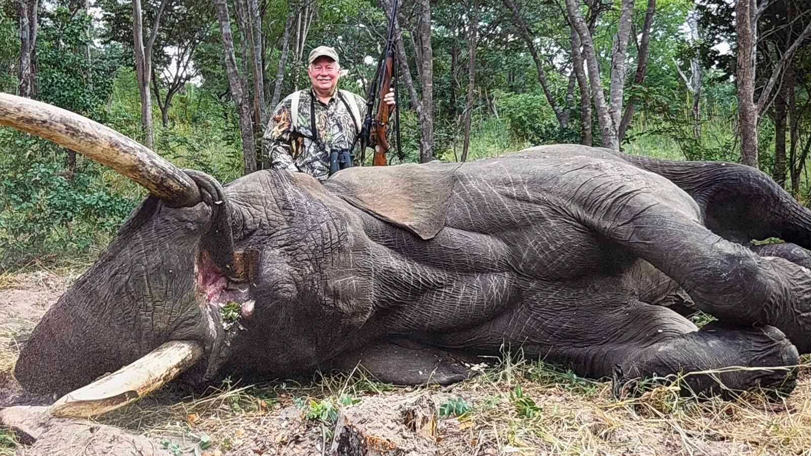 Rick Bonander poses behind a bull elephant harvested during a 2002 Zimbabwe safari. 