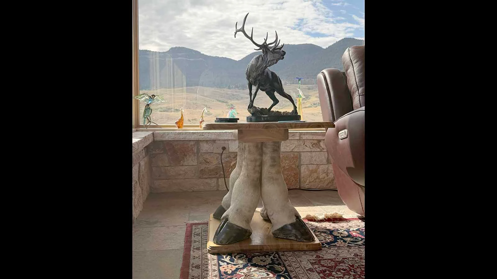 A side table supported by four giraffe legs is among the more unusual pieces in Rick Bonander's Casper home. 
