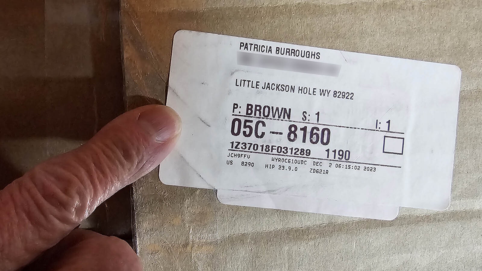 Pat Burroughs points to the Little Jackson Hole address on a package she recently received.